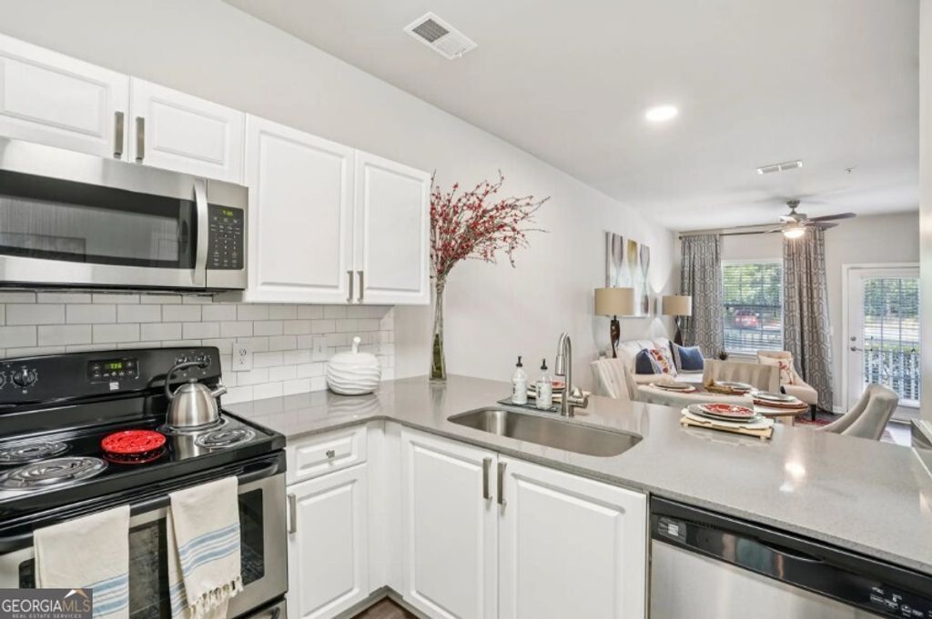 Photo of 405 Phillip Boulevard #1406, Lawrenceville, GA 30046 (MLS # 10661272)