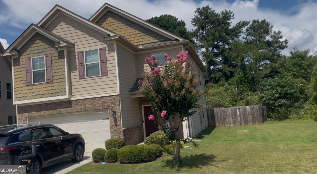 Just Listed! Beautiful 4-Bedroom Home in Lithonia, GA 2490 Oakleaf Ridge, Lithonia, GA 30058 Welcome to this well-maintained 4-bedroom, 2.5-bath single-family home located in the Oakleaf at Stonecrest community. Built in 2015, this spacious residence offers 2,220 square feet of living space with an open-concept floor plan, high ceilings, and beautiful hardwood flooring on the main level. The main floor features a versatile dining area, a generous family room, and a modern kitchen with ample storage and an additional room great for lounge, storage or office space. Upstairs includes a foyer overlooking the entry way. All four carpeted bedrooms provide comfort and space, including the owner's suite with a walk-in closet, dual vanities (his and hers), a garden tub, separate shower, and private toilet room. Secondary bedrooms share a full bath. Situated on a spacious, leveled, low-maintenance 0.03-acre lot, with 2-car garage, slab foundation, and a fenced-in backyard-ideal for entertaining or enjoying quiet outdoor time. This home offers easy access to shopping, schools, dining, and I-20. Don't miss this move-in-ready gem-schedule your showing today! *APPOINTMENT REQUIRED*