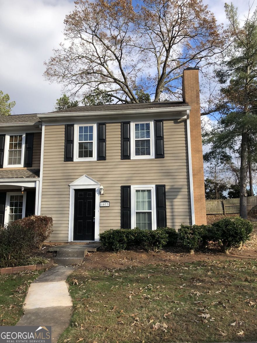 This freshly painted spacious end unit was updated in 2018. The main floor consists of a white galley-style kitchen, living room open to a dining room, half bathroom, and laundry room. Second floor consists of the Primary Bedroom with two closets, guest bedroom, and full bathroom. Outside there is a large, fenced backyard, spacious patio and utility room. There are two dedicated parking spaces in front of the townhouse. Amenities include swimming pool, tennis court and club house. Great Marietta city location - close to area shopping and restaurants! New windows installed in 2014.