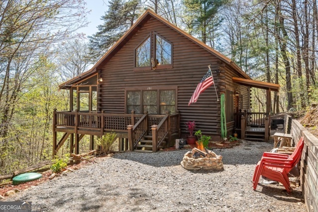 Back on the market after new projects completed! Freshly pressure washed, caulked and stained, new porch footers that leveled the front deck and also added new supports for the hot tub deck., new GFCIs, new vapor barrier in crawl, new HVAC duct lines and wires. This mountain adventure awaits you at this beautiful quintessential log cabin tucked deep into the woods yet a hop, skip and a jump to town. This 2 bedroom (the loft is the second bedroom/sleeping area) 1 bath log cabin checks all the boxes! Weekend getaway? Check! Private? Check! Furnished? Check! Short term rentals allowed? Check! No HOA? Check! All that is missing is you! Ready for you to create your mountain memories for years to come.