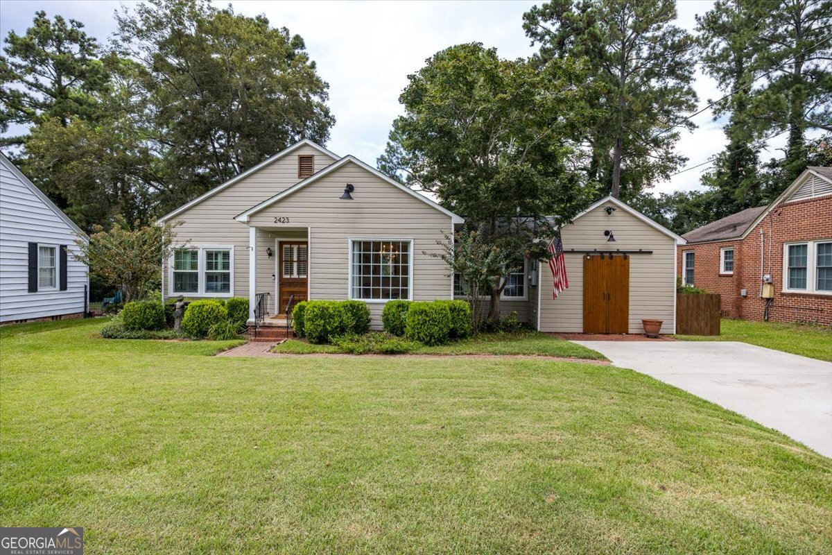 Charming Cottage a block from Ingleside Village and all the fun of Midtown Macon! Wonderfully maintained home with hardwood floors throughout, plantation shutters and large sunroom. Deck and side rear porch for outdoor entertainment. Beautiful landscaped and fenced backyard with great outbuilding. This on won't last long!