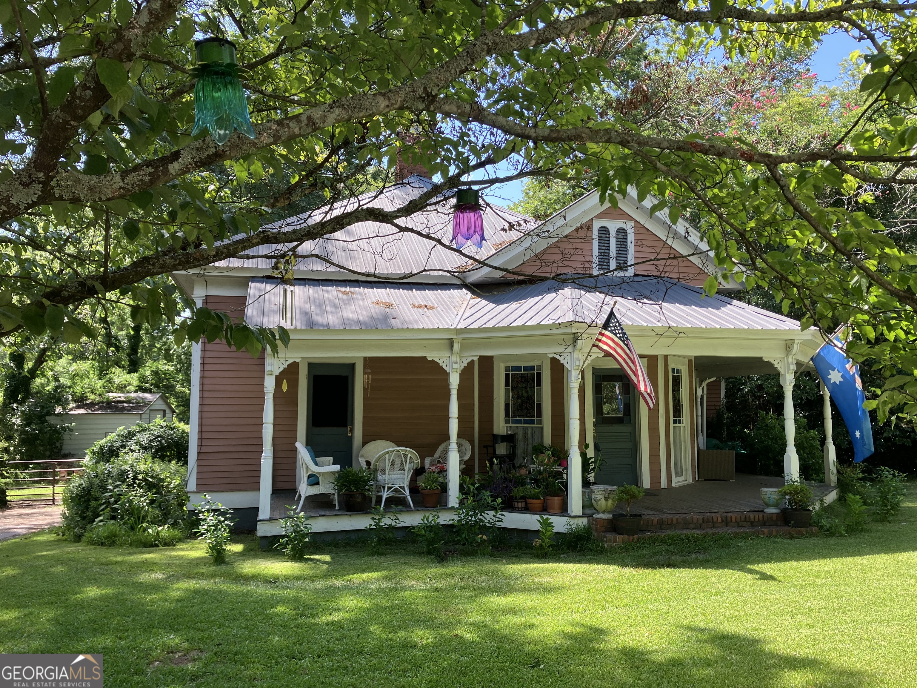 Charming victorian in downtown Monticello, on a street lined with updated classic homes, walking distance to shops and cafes. Come home to your cottage, sip lemonade on the front porch, or stroll to downtown shops. Lovely yard with fruit trees, mature pecans/walnut trees, garden and play area, and outbuilding/garage. Charter schools and so much more to enjoy in the up-and-coming new/old town of Monticello. Come make this home yours and put your finishing touches and updates on a classic filled with 12 foot ceilings, original moulding, hardwood ceilings/floors, and so much character.