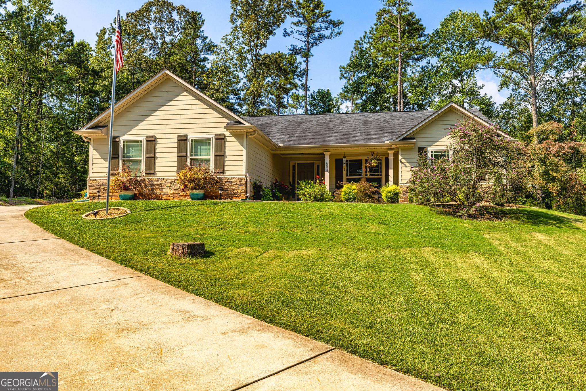 Country living with modern conveniences and comfort await in this meticulously maintained 4 bedroom 2 full bath home on 1.6 acres. As you enter the foyer you are greeted with a formal dining room on the right and an open living room with fireplace straight ahead. Left of the living room is the primary suite, a full bath with separate shower, soaking tub, and walk-in closet. Next to the great room to the right is a spacious breakfast area, and kitchen with stainless steel appliances. Off of the breakfast area is a hallway with 3 bedrooms (one could be used as and office) and a full bath. The lot offers plenty of room to expand, and a serene view from the front porch. Don't miss this opportunity to experience the beauty and serenity of country living at its finest.