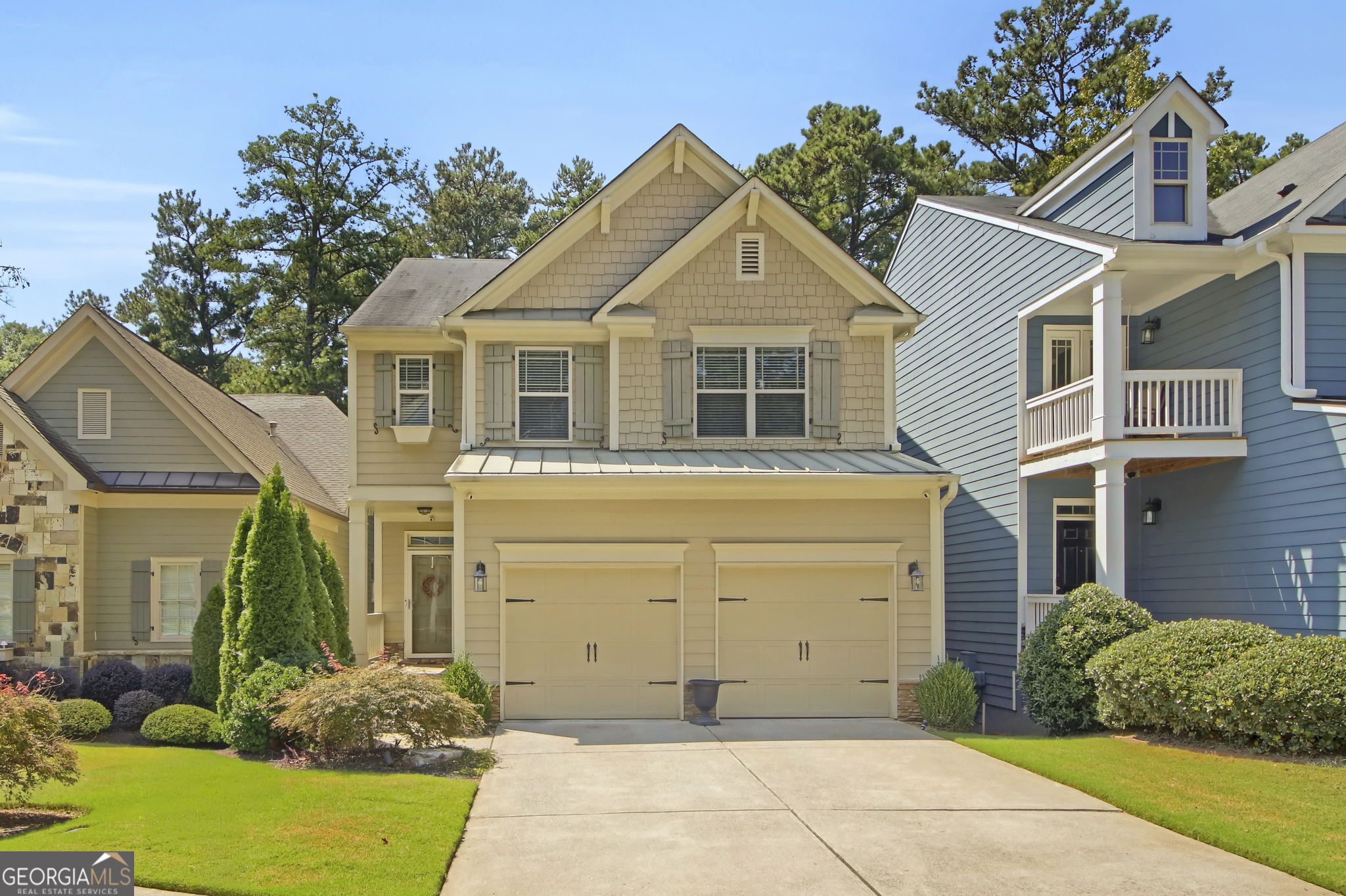 Welcome to the largest property in Whispering Lake, ideally positioned near scenic Lake Proctor. This move-in ready Craftsman-style home offers a spacious open floor plan with a welcoming foyer leading into the family room, dining area, and a beautifully upgraded kitchen featuring granite countertops, dark wood cabinetry, stainless steel appliances, 42" crown-molded cabinets, and a large island with bar seating. Enjoy rich dark hardwood floors, Wi-Fi/Alexa-powered energy-efficient lighting, and bidets in every bathroom. Upstairs, the Owner's Suite includes a trey ceiling, huge walk-in closet, and a spa-like bath with double vanities, soaking tub, and separate shower. A flexible loft space serves perfectly as a home office or reading nook, and the upstairs laundry adds convenience. The finished basement includes a hidden bonus room behind a secret door, perfect for storage, a media room, or a wow-factor feature your guests will love. Step outside to a custom stone patio with views of the lake and woods - your private, peaceful retreat. This home is packed with upgrades and smart features. Ask the agent about lighting/paint packages. Don't miss your chance to own this one-of-a-kind gem in Whispering Lake - schedule your private tour today!