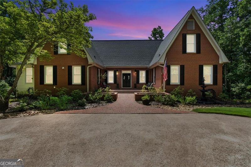 Stunning 6-Bedroom Estate on 3.59 Acres with Finished Basement and Dual Driveways Luxurious Space and Endless Possibilities on Expansive Estate: Welcome to your 4-sided brick dream home-an expansive 4-bedroom, 5.5-bath masterpiece, gracefully situated on 3.34 acres of beautiful property where elegance and comfort come together in perfect harmony. Upon arrival, a dramatic double staircase graces the grand entrance, setting an impressive tone as you step inside. Main Level Retreat: On the main floor, discover a spacious master suite designed for restful nights and private mornings. The chef's kitchen is a culinary haven, boasting abundant cabinetry for all your storage needs, complemented by a butler's pantry with even more space for organization or entertaining prep. The open floor plan flows effortlessly into formal and casual living spaces, creating the perfect backdrop for gatherings large and small. Upstairs Sanctuary: The upper level offers two additional bedroom suites, each with their own bathrooms for privacy and comfort. Attached to both of these bedrooms are generous bonus rooms-flex spaces that could serve as luxurious, room-sized closets, private offices, playrooms, or even cozy studios tailored to your needs. The versatility of these attached rooms adds a unique dimension of convenience and luxury for family or guests. Impressive First Impressions Two distinct driveways elevate the exterior: a stately circular drive welcomes guests at the front, while a secondary drive leads to the double car garage, offering direct access for daily living and convenience. Outdoor Living Reimagined: Nestled on 3.34 acres, the property offers both privacy and room to breathe. At the rear, a magnificent porch stretches across the upper deck-partially screened for year-round enjoyment-with panoramic views of mature trees and natural beauty. Envision summer afternoons on the lower-level porch, which mirrors the full span above and provides ample space for outdoor relaxation or entertaining. The generous grounds are perfectly poised for an infinity pool, making this an entertainer's paradise. Exceptional Finished Basement: The finished basement offers a world of possibilities. It features a private bedroom with an en suite bath, a full kitchen, a dining area, and a generous living room complete with a cozy fireplace. The dedicated man cave promises a retreat for relaxation or recreation. With its private entrance and full amenities, this space is ideal for an in-law suite or comfortable, long-term guest accommodations. There is a hookup for washer and dryer as well to make it the complete package. For the person who loves to tinker with tools, there is a great space for all the tools you could want and still have room for a workspace. Unmatched Space and Flexibility: With so many living areas, storage options, and luxurious finishes throughout-including two upstairs suites with bonus rooms-this home is designed to accommodate every lifestyle. Whether hosting grand celebrations or enjoying a quiet evening by the fire, the 3.34 acres provide ample space for outdoor adventures, gardening, or simply savoring the tranquility of your own private retreat. Don't miss the opportunity to own this extraordinary residence, where every detail has been thoughtfully crafted for comfort, style, and exceptional living. There is also a separate garage (20x20) that was built in 2023 on a poured concrete floor. Carolina site built garage; 2 roll up doors; 10x10 and 8x9; 1 standard side door; 2 windows with screens; 11 foot walls, 16 foot center; green body with brown trim and roof to blend in with nature. Schedule your private tour and experience the endless possibilities!