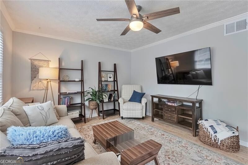 2-Bed, 2.5-Bath Townhome in a gated Buckhead Golf, Swim & Tennis Community! Discover this beautifully updated 2-bedroom, 2.5-bathroom townhome in a sought-after golf, swim, and tennis community. This move-in-ready home features newer kitchen appliances (2021), newer washing machine (2022) and HVAC system (2022), a new hot water heater (2025) for worry-free living. You will also find fresh paint, new blinds, and stunning hardwood floors throughout-no carpet! The spacious living area opens to a private patio/courtyard, perfect for relaxing or entertaining. The bathrooms have been updated, including a new bathtub and surround and the other full bath features a walk-in shower. New ceiling fans add comfort and style. All the windows were replaced prior to this owner. Located just minutes from downtown Atlanta and only 15 minutes from the airport, this home is in the award-winning MORRIS school district and surrounded by convenient shopping and dining options. HOA PAYS FOR: Water, Trash, Roof, Landscaping, Exterior Maintenance, Pools, Tennis & Pickle ball. Golf is $10/round for 18 holes, Gym membership is $35/ month. There's a caf & bar on the property, too! Don't miss this opportunity to own a stylish, updated townhome in a prime location!