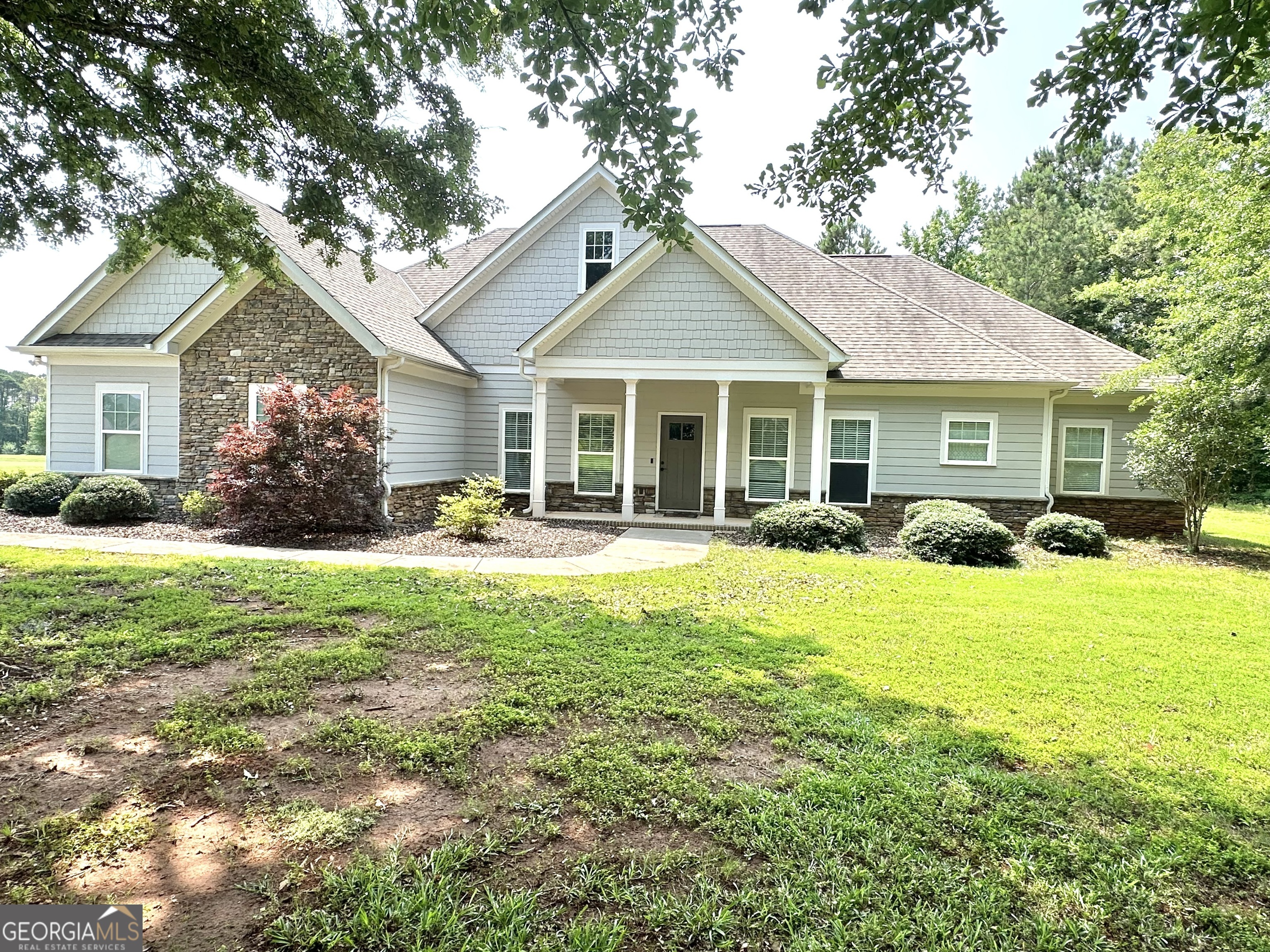 This elegant home offers the perfect blend of space, style, and function on a level 1.494-acre lot in the sought-after Riverside Subdivision. Inside, you'll find high ceilings, a dramatic foyer, and a coffered ceiling in the living room. The open floor plan features a main-level primary suite with a tiled shower, double vanity, and walk-in closet, plus a split-bedroom layout for added privacy. Tile baths and upscale finishes run throughout the home. A generously sized bonus room upstairs provides flexible space for a home office, media room, playroom, and more. Enjoy outdoor living on the large covered back porch, which is ideal for entertaining or quiet evenings. With a prime location and thoughtful design, this property delivers exceptional value and comfort. Schedule your private showing today.