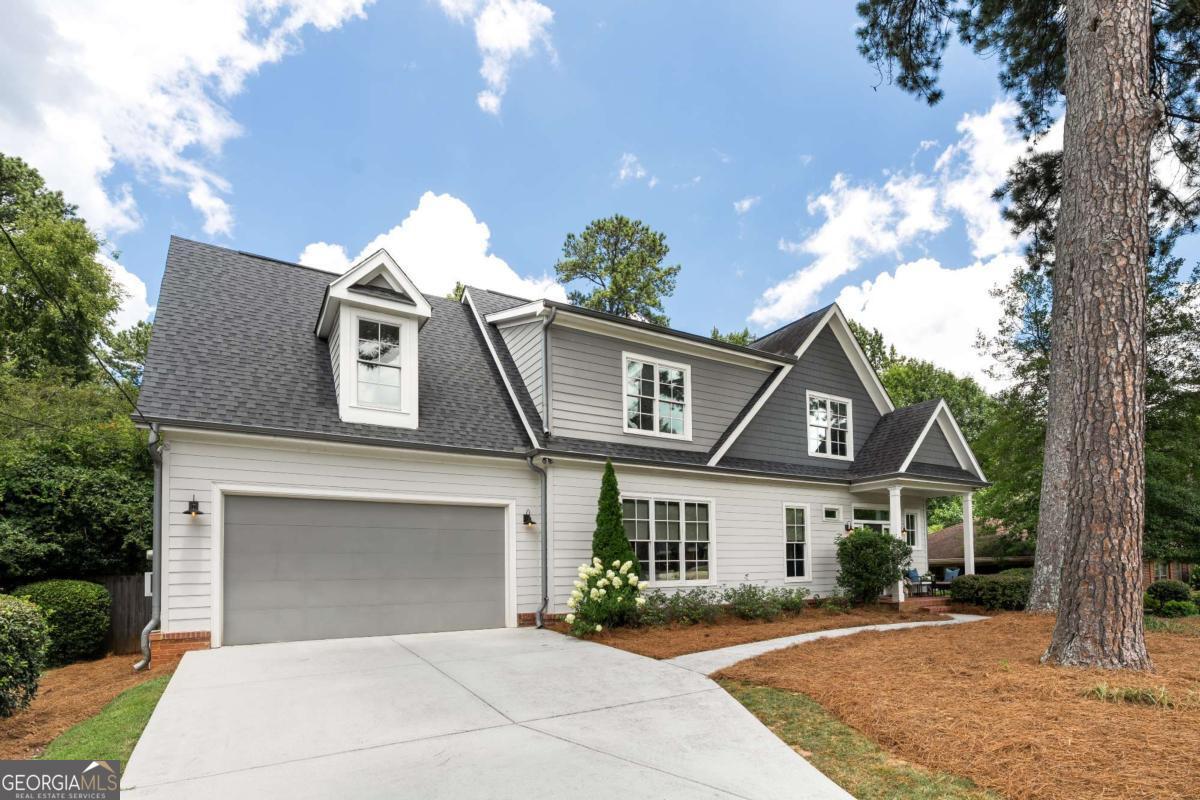This custom built Sagamore home is overflowing with luxury features. Stunning kitchen w/ marble countertops, inset custom cabinetry, rift-sawn white oak appliance garage, Subzero refrigerator, Bertazzoni 48" dual-fuel range, & a massive walk-in pantry. The main living area is drenched in natural light & features a custom media built-in, fireplace, & 10 foot ceilings. First level bedroom + full bath also has a fireplace with another wall of custom built-ins. Upstairs you'll find a generously sized primary suite w/ a resort level bath & large walk-in closet that connects w/ the laundry room. Three other bedrooms, two more full baths, and an incredibly versatile bonus space are also located on this level. The huge rear deck is perfect for entertaining or just enjoying the outdoors while overlooking the private & fully fenced backyard. The two car garage is prewired for an EV charger. Viewed by appointment only.