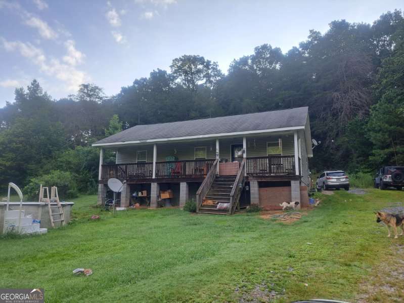 Welcome to your private retreat in La Fayette, GA!! This incredible 3 bedroom, 2 bathroom, 1144 square foot property has so much to offer anyone looking to put a little sweat equity into it!! This property has the convenience of being just miles from the city and all schools, dining, and entertainment while still having privacy to enjoy all of the activities you want at home on the almost 3 acres of land this would be a great fit whether you are just starting out or looking for a quiet area you can settle down and enjoy some peace!! This property will not last long, schedule a showing today!! Sold as-is,