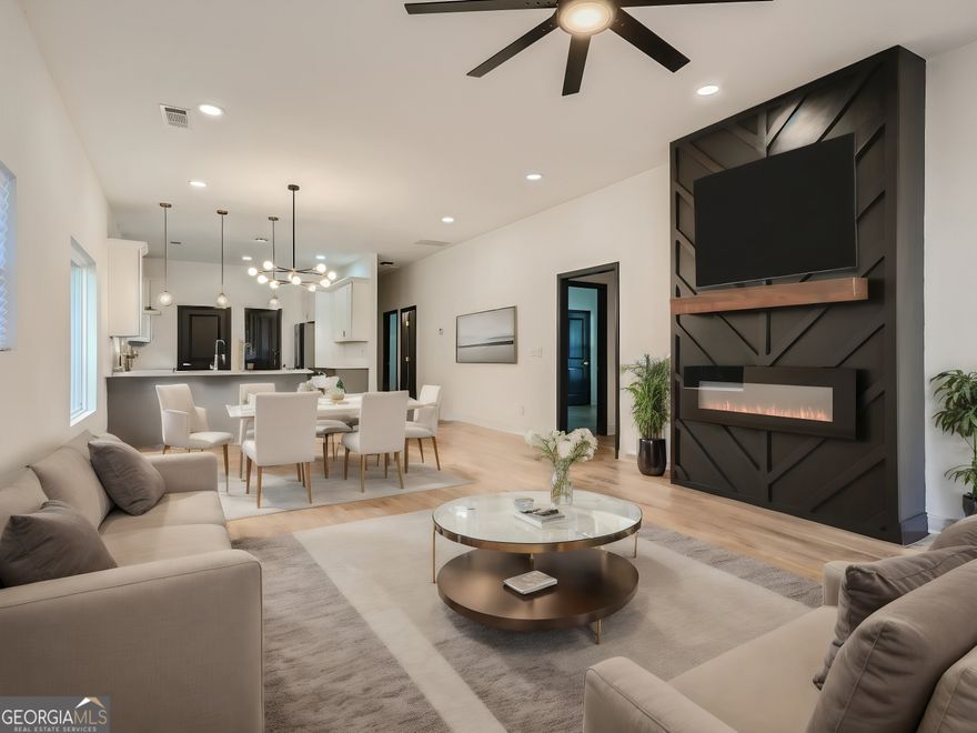 This is a must see! Charming fully renovated craftsman bungalow nestled in the popular Capitol View neighborhood. The home will captivate you from the start with the picture perfect, covered front porch, that leads inside to the bright, open floor plan boasting 10 ft ceilings, electric fireplace feature wall and beautiful hardwood floors throughout the entire home. The stylish kitchen features quartz countertops, shaker cabinetry, beautifully tiled backsplash, a full stainless steel appliance package and a walk-in pantry. Owners' suite with a spa-like master bathroom featuring double vanities, walk-in shower with modern soaking tub, and a walk-in closet. Access the wrap around deck with fully fenced backyard to provide added privacy and security for you and your loved ones. Fantastic location just 15 minutes to midtown or the airport with quick access to 1-85 and I-20. Steps away from Perkerson Park, the Beltline, West End District, Atlanta's top breweries, MARTA, coffee shops, and eateries. You will love living in the highly desirable neighborhood of Capitol View!