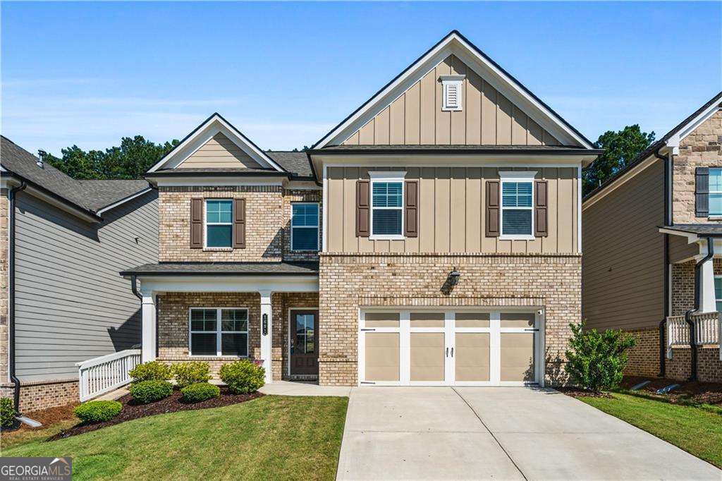 Welcome to this beautifully maintained, like-new home built in 2022, offering 4 spacious bedrooms, 2.5 baths, and a thoughtfully designed floor plan perfect for modern living. From the moment you step inside, you'll notice the quality craftsmanship and stylish finishes that make this home truly stand out. The heart of the home is the extended gourmet kitchen, featuring stunning granite countertops, a 5-burner gas cooktop, built-in wall oven and microwave, and abundant cabinet space for all your storage needs. The open-concept layout flows seamlessly into the family room, where a striking stacked stone fireplace and coffered ceilings create a warm and inviting space to relax or entertain. Hardwood-style flooring flows throughout the main level, upper hallway, and into the luxurious primary suite. The front flex room offers versatility-ideal for a formal dining room, home office, or creative space. Upstairs, the generous primary suite is a true retreat, complete with a large walk-in closet and a bright, airy bathroom featuring dual vanities and an oversized tiled shower. The laundry room is conveniently located on the second floor for easy access. Enjoy outdoor living year-round on the screened-in patio overlooking the fenced backyard-perfect for entertaining, pets, or play. Additional features include smart home technology and a 2-car garage. Ideally situated near top-rated schools, shopping, and dining, this home combines comfort, convenience, and style in one exceptional package.