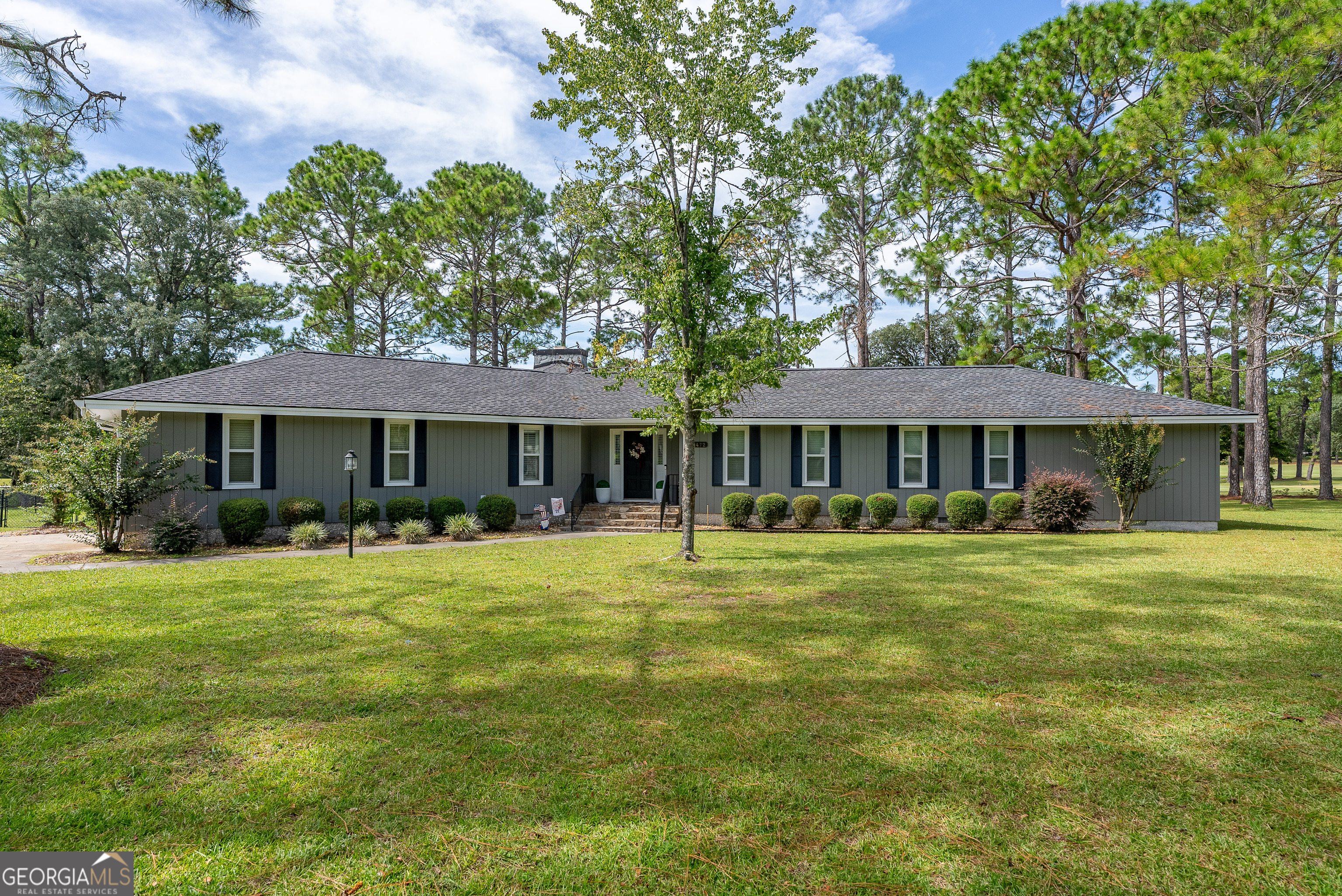 Welcome to 1472 S River Oaks, a beautifully updated 3 bedroom, 2 bath home with 2,023 sq. ft. of living space, located in the highly sought-after Okefenokee Golf Club community on the 3rd hole. This home offers an open floor plan designed for both everyday living and entertaining, complete with a spacious walk-in pantry, a massive walk-in closet, and custom built cabinetry throughout. Inside, you'll find top quality Shaw 20 mil luxury vinyl plank flooring paired with color body porcelain tile, stunning quartzite countertops, and solid wood plantation shutters that elevate every room. Large open windows provide an abundance of natural light and overlook the fenced backyard and wrap-around deck, creating the perfect space to relax or entertain. Recent updates include blown-in insulation in the attic and garage for energy efficiency, and a 6-year-old architectural shingle roof for peace of mind. The property features an attached 2-car garage plus a detached garage with power, perfect for additional storage or workspace. An insulated shop with A/C (built 5 years ago) and a custom fire pit adds even more to the lifestyle this home provides. This home is located in the desirable Midway Elementary School District. Living in Okefenokee Golf Club offers the charm of a well-kept community and golf course views, but it's important to note that HOA dues are for neighborhood upkeep only and do not include access to the pool, tennis courts, or clubhouse.