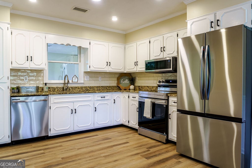 Photo of 412 Oasis Drive, Dublin, GA 31021 (MLS # 10880064)