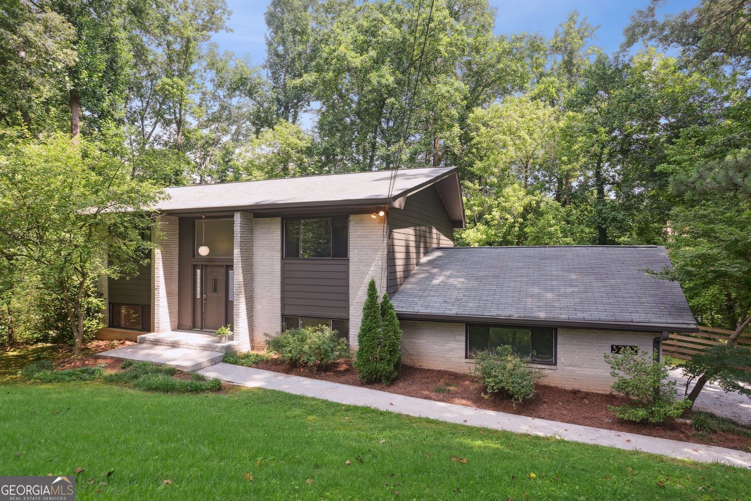 Mid-Century Modern Charm Meets Incredible Space! Welcome to 3282 Leslie Court - a hidden gem tucked into a quiet cul-de-sac in the heart of Atlanta's desirable 30345 ZIP code. Built in 1964, this classic split-foyer home exudes mid-century modern vibes with its clean lines, open layout, and warm, inviting character. Step inside to discover a surprisingly spacious floor plan featuring 4 bedrooms and 2.5 baths, along with a formal living room, dining room, cozy family room, and a light-filled sunroom perfect for relaxing or entertaining. This home has been thoughtfully maintained with a long list of updates, including: a new washer and dryer (2016), heat pump and AC system (2018), and a new water main line from the street (2020). Major upgrades continue with a new roof (2021), hot water heater (2022), refreshed fuse box and whole-house surge protector (2022), Sunroom mini-split unit (2022), induction stove and dishwasher (2022), garbage disposal (2023), new garage door and motor (2024), and in 2025-fresh interior and exterior paint, all new toilets, new LVP flooring downstairs, and refinished hardwoods upstairs. The attached 2-car garage adds convenience and storage, and the location is unbeatable-just minutes from Northlake shopping and dining, with easy access to Emory, the CDC, and I-285. Don't miss this one-of-a-kind opportunity to own a home with classic architecture, modern comforts, and endless potential!