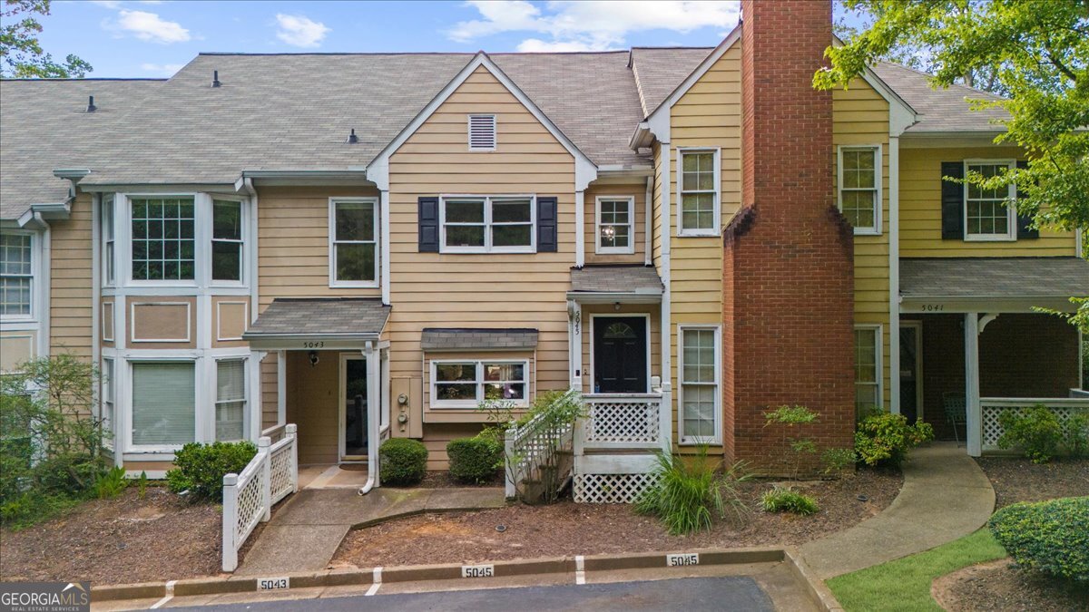 This 2-bedroom, 2-bath condo offers comfortable, low-maintenance living in a prime location served by top-rated schools and just minutes from Avalon, Downtown Alpharetta, Downtown Roswell, Halcyon, North Point Mall, GA 400, the Alpharetta Greenway, and nearby parks. Located in a desirable swim/tennis community, the HOA covers water, sewer, trash, landscaping, pest and termite control, and exterior maintenance for added convenience. Inside, the main level features hardwood floors and a vaulted ceiling in the living room with a cozy fireplace. A bright sunroom provides flexible space for a home office, reading nook, or casual dining. The kitchen includes granite countertops, a modern smart oven with induction cooktop, and a Bosch dishwasher. The home also features a smart washer/dryer combo for added efficiency. Recent updates include a one-year-old roof, new electrical outlets and switches, and fresh paint throughout. With abundant natural light and neutral finishes, this home offers easy living in one of the area's most sought-after locations.