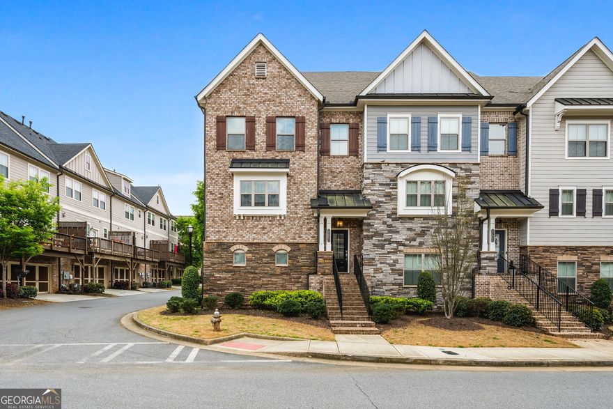 Welcome to 173 Marietta Walk Trace   a beautifully maintained, move-in ready townhome located just steps from Historic Marietta Square. This 3-bedroom, 3.5-bathroom home offers modern design, spacious living, and an unbeatable walkable location. The open-concept main level features a bright living area with hardwood floors, elegant crown molding, and seamless flow into the dining space and kitchen. The gourmet kitchen boasts stainless steel appliances, granite countertops, a large center island with bar seating, and a walk-in pantry   perfect for everyday living and entertaining alike. Upstairs, the oversized primary suite provides a relaxing retreat with a spa-inspired en-suite bathroom and generous walk-in closet. A secondary bedroom with its own private full bath completes the upper level. The terrace level offers a third bedroom with its own private en-suite full bathroom   ideal for a guest suite, roommate setup, or private home office. Additional features include a private balcony, two-car garage, and access to community amenities including a pool and green space. Enjoy the low-maintenance lifestyle of Marietta Walk while living just minutes from dining, shopping, weekend festivals, and everything Marietta Square has to offer.