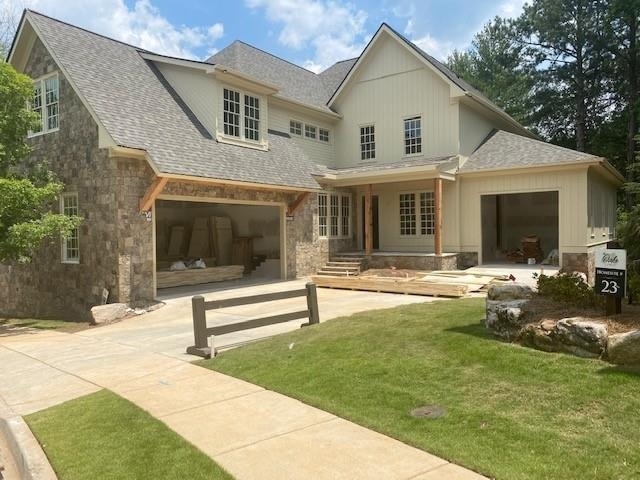 Luxurious new construction with 6 Bedrooms & 5.5 baths in coveted East Cobb showcases gorgeous stone and vertical tongue & groove cement siding with charming flagstone front porch and a 3-car garage. A dramatic 2-story, vaulted great room with wooden beams features a wall of windows overlooking the professionally landscaped rear lawn with room for a pool, & French doors lead to a large covered back porch providing a cozy outdoor retreat. The main level offers 2 bedrooms including a guest room with en-suite bath & the inviting owner's suite boasting a lavish bath with soaking tub, his & her vanities, and a large stepless shower. Thermador appliances, custom cabinetry, work island with breakfast bar & stone countertops adorn this Chef's kitchen that opens to the family room & large dining area - perfect for entertaining. A convenient office or flex room, laundry room & powder room complete the main level. Transcending to the upper level you walk into a spacious loft area which makes a perfect spot for gathering with friends, a media room or teen hang-out area. The second level also features 4 very spacious bedrooms (one which could easily be used as a large media room or office), 3 full baths, another full-sized laundry room & permanent stairs to a floored attic providing great storage. The unfinished terrace level is stubbed for a bath & ready for finishing & showcases a panorama sliding glass door opening to the patio and level back yard, ready for creating your own professionally designed outdoor living space with potential for a pool, outdoor fireplace and/or hot tub. The possibilities are endless! This luxuriously appointed home features the highest quality craftsmanship and designer touches throughout.