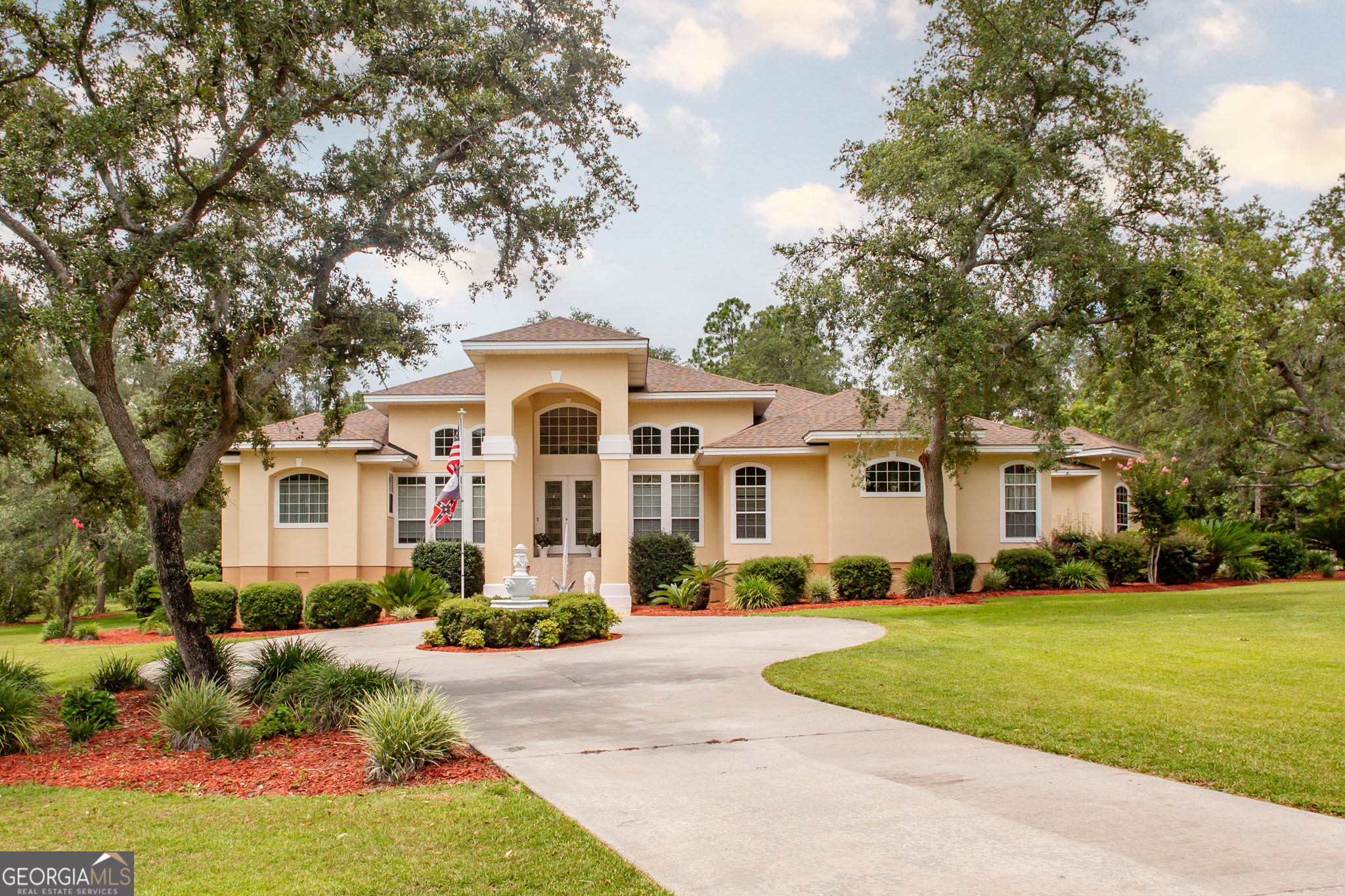 Welcome to your dream home nestled within the prestigious Okefenokee Country Club! This stunning 4-bedroom, 3-bathroom residence offers an exceptional blend of luxury and comfort, perfect for family living and entertaining. As you enter the home, you'll be greeted by an expansive layout featuring tall ceilings that enhance the sense of space and light throughout. The inviting living areas seamlessly connect, creating an ideal environment for gatherings and relaxation. Retreat to the spacious master suite, complete with an en-suite bathroom featuring dual vanities, a soaking tub, and a separate shower. The additional three bedrooms are generously sized, providing plenty of room for family or guests. Step outside to discover your private oasis! The large lot boasts beautifully manicured lawns with sprinkler system, perfect for outdoor activities. Enjoy sunny days lounging by the sparkling club swimming pool or challenge friends to a match on the community tennis courts. For those with a passion for hobbies or extra storage needs, the property features both attached and detached garages, offering abundant space for vehicles and equipment. Don't miss the opportunity to make this exquisite property your forever home. Schedule a viewing today and experience the lifestyle that Okefenokee Country Club has to offer!