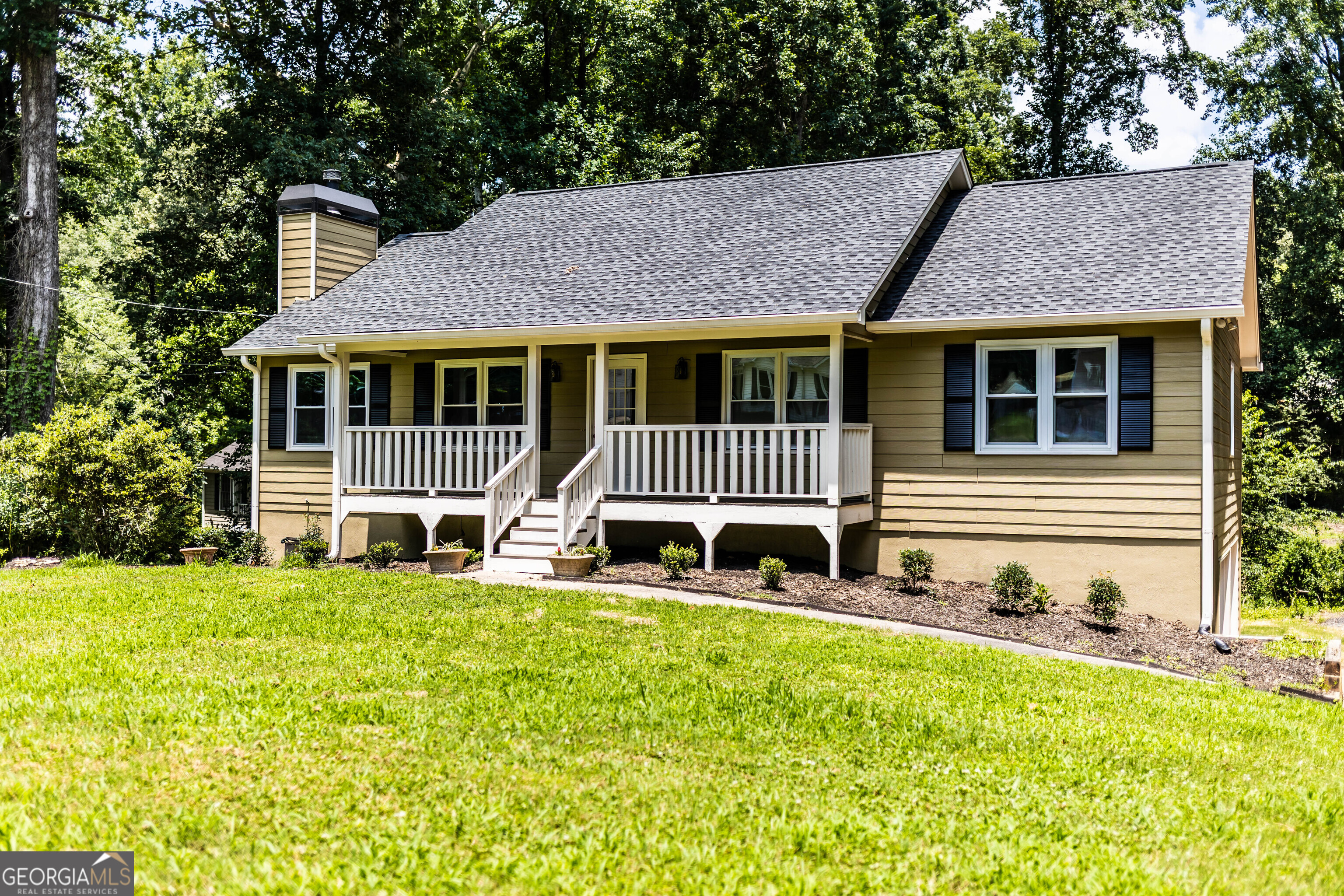 Welcome to 312 North Briar Ridge, a beautifully updated home located in the desirable Magnolia Walk Subdivision in Woodstock, Cherokee County, GA. This spacious 3-bedroom, 2-bathroom home offers 2,031 square feet of living space, including a dining room, fireplace, and over 600 square feet of finished space in the basement. Built in 1985, this home has been thoughtfully upgraded to meet modern comfort and style. Enjoy peace of mind with a new Architectural shingle roof, gutters and downspouts, cement fiber soffit and fascia all installed in February, plus fresh interior and exterior paint that brings a bright and welcoming feel throughout. The property sits on a generous 0.48-acre lot. Outdoor lovers will appreciate the brand-new back deck overlooking a large, private backyard, perfect for entertaining, relaxing, or playing. Two-car garage under the main floor features insulated garage doors and super quiet garage door openers installed in 2020. No HOA! School districts are Boston Elementary, ET Booth & Etowah High. Just under 30 minutes to Red Top Mountain State Park, you'll have easy access to hiking, boating, and nature escapes, while still enjoying all the conveniences of Woodstock living.