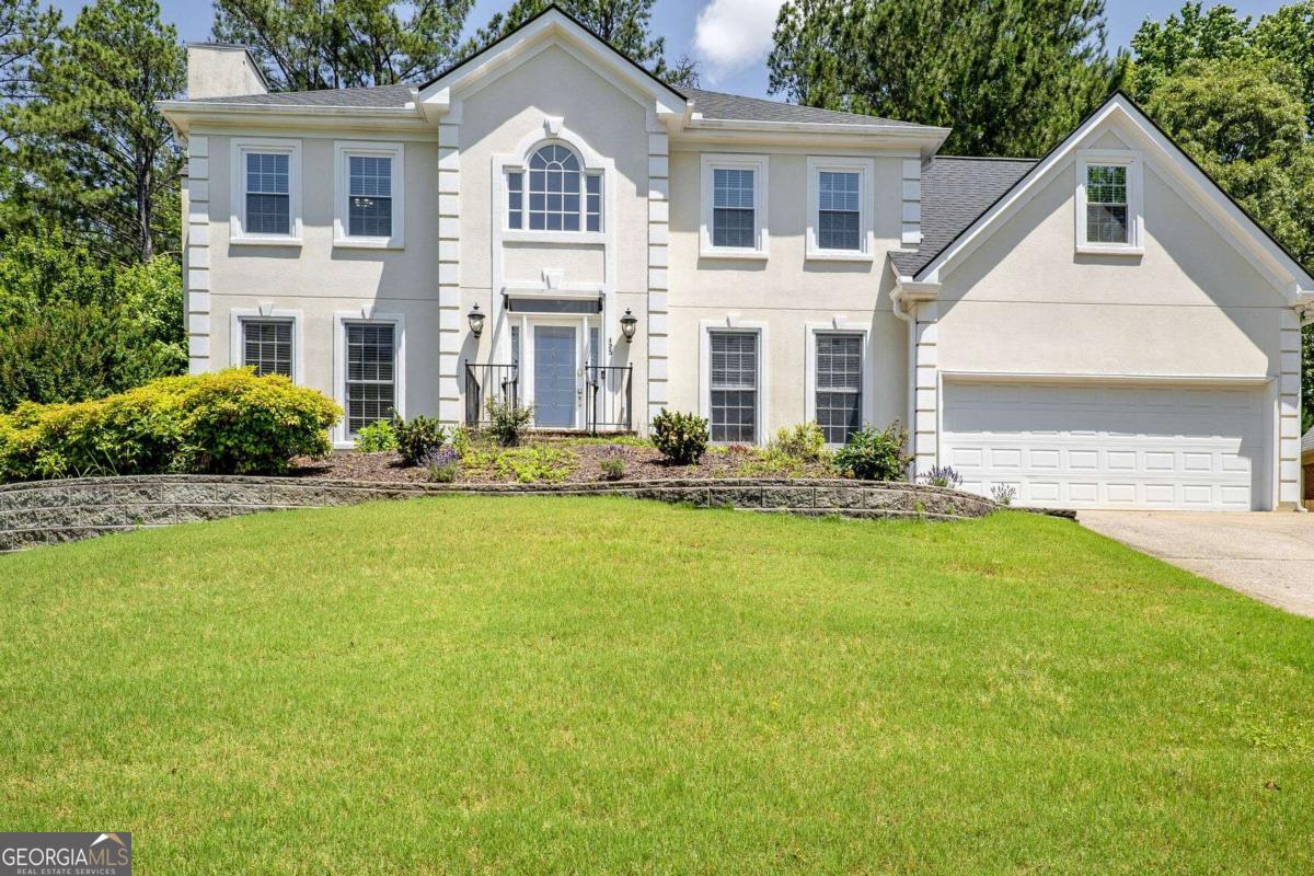 Fall in love with 125 Sandridge Ct. in the highly acclaimed subdivision of Tuxford in Alpharetta. This beautiful stately home with 5 bedrooms and 3 full baths. Gorgeous and bright two-story foyer sets the stage for this grand home. The spacious living room features dramatic cathedral ceilings, a fireplace with brick surround to the ceiling, and an abundance of windows. The formal dining room and office/flex space offer classic charm. The main-level bedroom with a full bath for guests. The kitchen with granite countertops and wood floors. Lux living in the upstairs primary bedroom with, charming fireplace, and ensuite bathroom offering dual sinks, jetted tub, and walk-in closet. The possibilities continue in the unfinished basement, with ample space ready to be transformed. This exceptional property offers the best of the best within your reasonable budget. The oversized Deck is perfect for enjoying the serene backyard and mature trees year-round. This established Tuxford neighborhood has 2 swim/tennis amenities, Top-rated schools and easy access to some of North Atlanta's best shopping, dining, and parks. Enjoy unbeatable proximity to GA 400 and top local attractions like Avalon, Halcyon, North Point Mall, Webb Bridge Park, and Ocee Park.