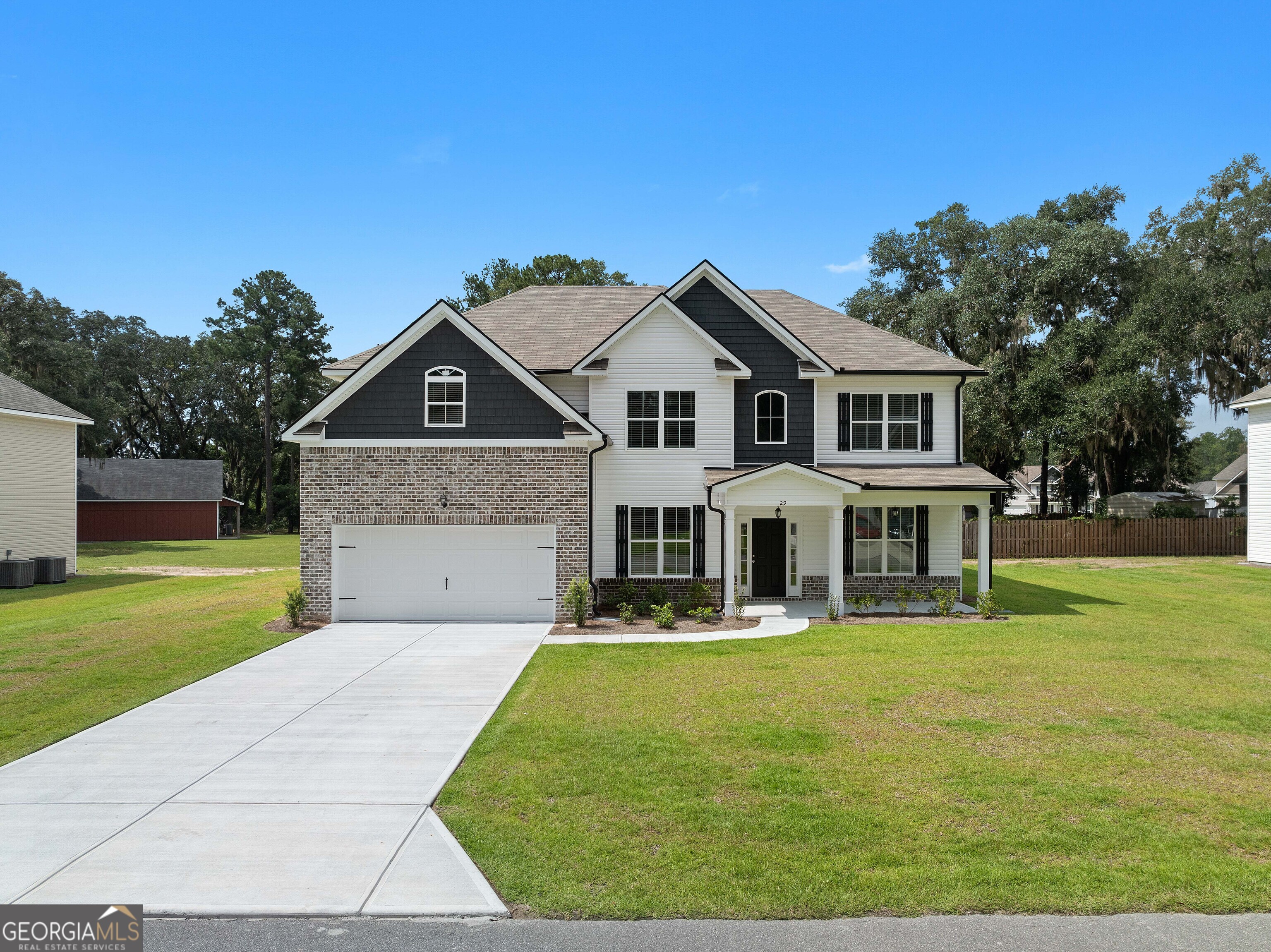 Experience timeless elegance with the sought-after Faircloth Homes 3665 floor plan. The main level showcases a formal dining room with a coffered ceiling, a private study, and a soaring two-story great room accented by a fireplace and a dramatic staircase. The chef's kitchen is designed for both style and function, featuring an oversized island, granite countertops, double ovens, a ceramic cooktop, and a built-in microwave. A guest suite with a full bath completes the first floor, offering comfort and convenience. Upstairs, the luxurious owner's retreat offers a private sitting area, spa-inspired bath with a garden tub, walk-in shower, and dual vanities, along with two expansive walk-in closets. Additional bedrooms provide flexibility for family, guests, or hobbies. With LVP flooring, premium finishes, and full irrigation, this home effortlessly blends sophistication with everyday functionality. Don't miss your opportunity to make it yours!