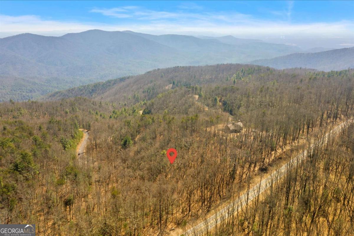 Stunning Building Lots in Gated Community of The Summit Subdivision atop Fort Mountain! These gorgeous lots offer double road frontage along Highway 52 and within the subdivision itself. Nestled on rolling hills with breathtaking views of the Great Smoky Mountains, these parcels provide the perfect backdrop for your dream home or vacation retreat. Located less than two miles from the outdoor wonders of Fort Mountain State Park, you'll have easy access to hiking, biking, and camping. The charming towns of Ellijay and Chatsworth are just a short drive away, offering a wide range of local amenities and attractions. This listing includes two parcels: Parcel 0103 039 002: 1.53 acres Parcel 0103 027: 2.55 acres Schedule a tour today!