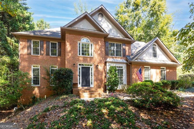 Back on the Market with Beautiful New Updates! Welcome to this spacious 6-bedroom, 5-bath home in the highly sought-after Charlton Forge Swim/Tennis community, ideally located in the Hickory Hills Elementary and Marietta High School district. Tucked away on a quiet cul-de-sac with friendly neighbors, this home offers the perfect blend of comfort, style, and convenience. Inside, you'll find an open-concept floor plan with an oversized kitchen featuring a large cooktop island, quartzite countertops, and brand-new stainless steel appliances. The kitchen flows seamlessly into the family room and onto the back porch-ideal for everyday living and effortless entertaining. The flexible layout includes a main-level guest suite, four bedrooms and three baths upstairs, plus a full bed/bath in the finished basement with its own entrance, making it perfect for guests, in-laws, or a private office. With dual laundry hookups, a formal dining room, and a versatile flex space, this home truly adapts to your lifestyle. Recent updates include fresh interior paint (2025), luxury vinyl plank flooring (2021), a renovated master bath with a large glass shower and jetted soaking tub, and energy-efficient windows with plantation shutters that help keep utility bills low. Major systems have also been updated, giving you peace of mind for years to come. Step outside to a flat, fenced half-acre lot with mature trees for privacy, a spacious back porch and lower patio, and seasonal views of Kennesaw Mountain. The yard has been thoughtfully graded with French drains (2024) to ensure long-term durability. Charlton Forge offers an unmatched lifestyle with swim, tennis, and clubhouse amenities just a short walk away, all while being minutes from schools, shopping, and Marietta Square. This home truly has it all-space, updates, location, and community. Don't miss your chance to make it yours!