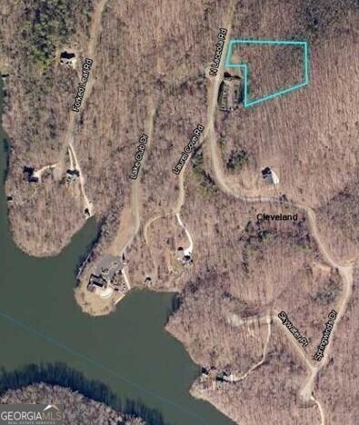 Laceola - The PREMIER gated lake community of White County. 100+ Acre Private lake for your enjoyment. This attractively priced lot is just a short (5 minute) walk to the clubhouse, dock and pool. Perfect location for a full time home or second home of your dreams. Lot is gently, sloped for mountain property, and building toward the back of the lot at a higher elevation may reveal views of the lake below and Mountain ranges to the north.