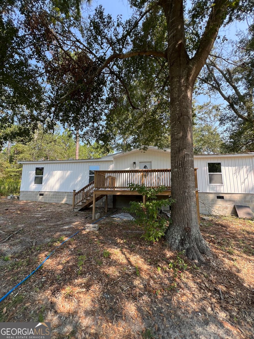 Privacy awaits you in this newly renovated home! If space is what you desire, this is the home for you! Each of the 3 bedrooms has an exceptionally large walk in closet. The 2 bathrooms have been updated with new showers, toilets and even a bluetooth speaker fan in the master bathroom to enjoy your favorite tunes! The kitchen includes an enormous butcher block top island to allow easy prep for those upcoming holiday meals. The home has large outdoor deck areas on the front and back to enjoy the sounds of nature while relaxing. Extra insulation will help with energy savings. This beauty has been recently updated with new sheetrock, paint, cabinets, light fixtures and more! Call today and make this your new address!