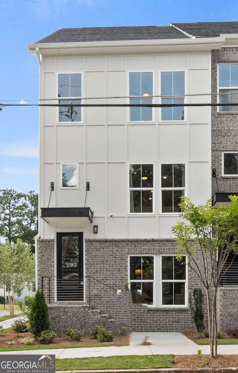 Welcome to 1871 Hollywood, a modern 4-story end-unit townhome by Pulte Homes in Atlanta's vibrant Upper Westside. This 3 bed, 3 full bath + 2 half bath home includes a rooftop loft oasis, perfect for entertaining or relaxing. Enjoy a bedroom with full en-suite on the terrace level, and a gourmet kitchen on the main with quartz countertops, soft-close cabinetry, and top-tier appliances. The open-concept living area flows into a sun-filled gathering room. Upstairs, the spacious primary suite offers a spa-like bath with rain shower, while a secondary bedroom with en-suite provides privacy. The rooftop level includes flexible loft space and an outdoor terrace with skyline views. Steps from Westside Village, The Works, Bellwood Coffee, and Provisions. Move-in ready NOW!! Pricing is adjusted to match the builder's current special and is subject to change.