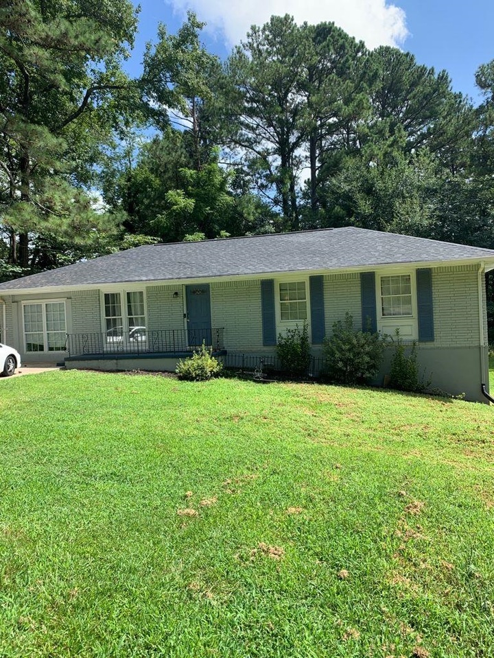 4 sided brick ranch-style Property, on corner lot with a total of 6 bedrooms and 4 bathrooms (including basement), large basement with private entry with 2 bedrooms and 2 bathrooms! Hardwoods in family room and dining! So much potential inside and out! Located in Marietta, Georgia.