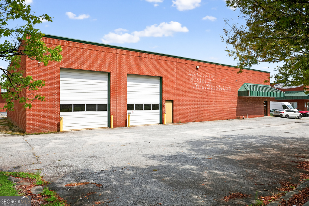 Flexible Commercial Facility Zoned C-2 - Ideal for a Range of Business Uses. This 6,161 SF building, currently used as a warehouse, was originally constructed for auto repair and offers excellent adaptability for a wide range of commercial operations. Situated on 0.70 acres and zoned C-2 in Gwinnett County, the property is well-suited for retail, service-based businesses, light industrial, or conversion back to an auto repair facility. The layout includes a reception area, loft space, and two restrooms, all within a functional single-story design. With 20 parking spaces (3.25 per 1,000 SF) and a solid infrastructure, this 2003-built property presents a strategic opportunity for an owner-user or investor in a high-demand commercial corridor.