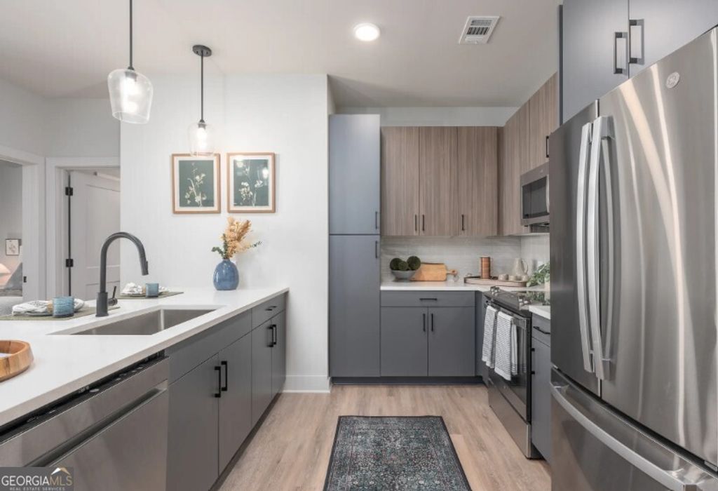 Photo of 1400 Laurel Crossing Parkway #1413, Buford, GA 30519 (MLS # 10655517)