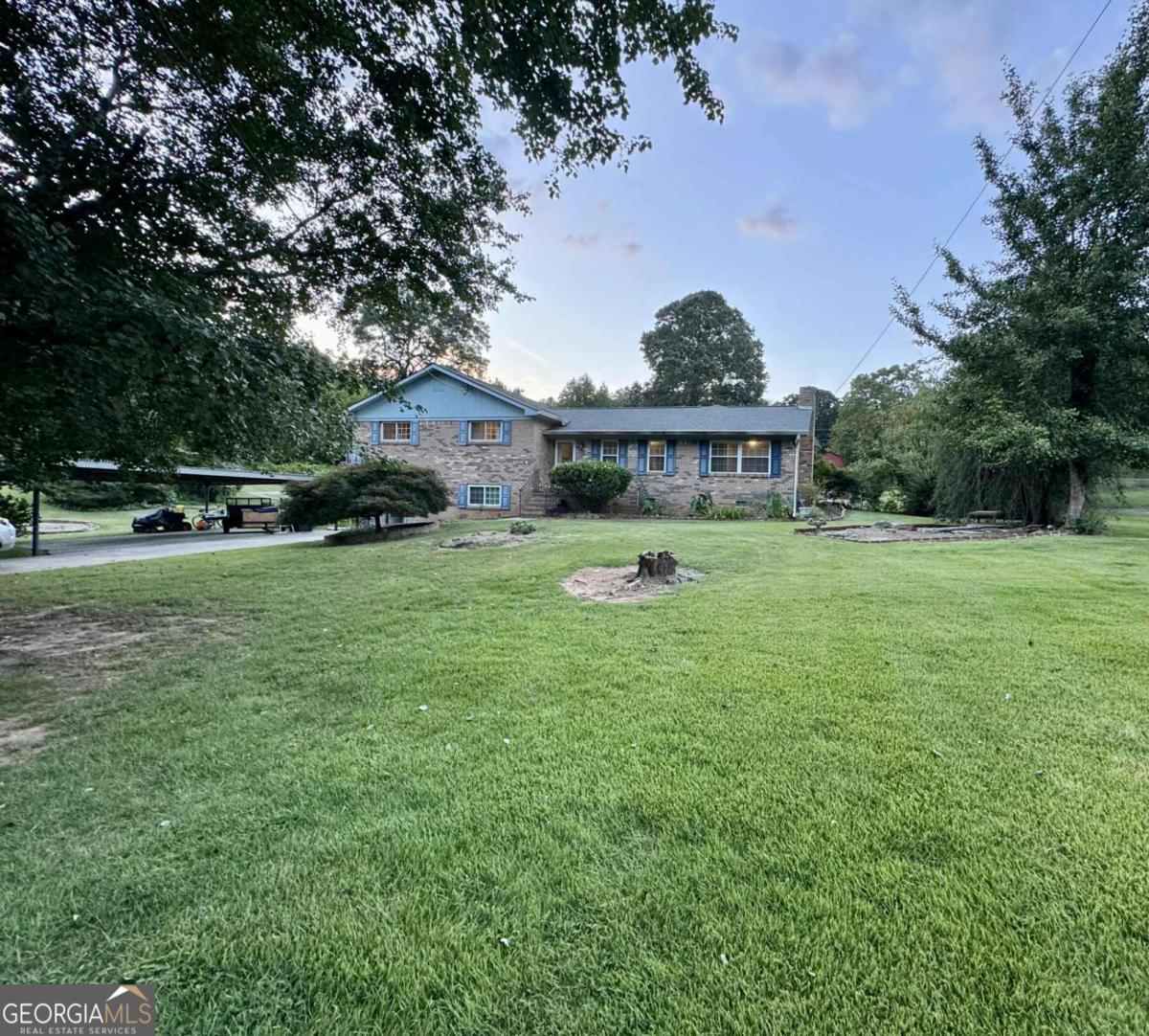 Professional Photos coming soon****All-brick ranch with inground pool just minutes from Downtown Woodstock! This spacious 3BR/2BA home offers 2,448 sq ft of living space on a partial basement. Enjoy a bright and open floor plan featuring a large four-seasons room, new luxury vinyl plank flooring, and plenty of natural light. Relax or entertain around the private inground pool. Solid four-sided brick construction, convenient location close to shopping, dining, and entertainment in Woodstock. A rare find combining space, updates, and prime location! This one has tons of potential!