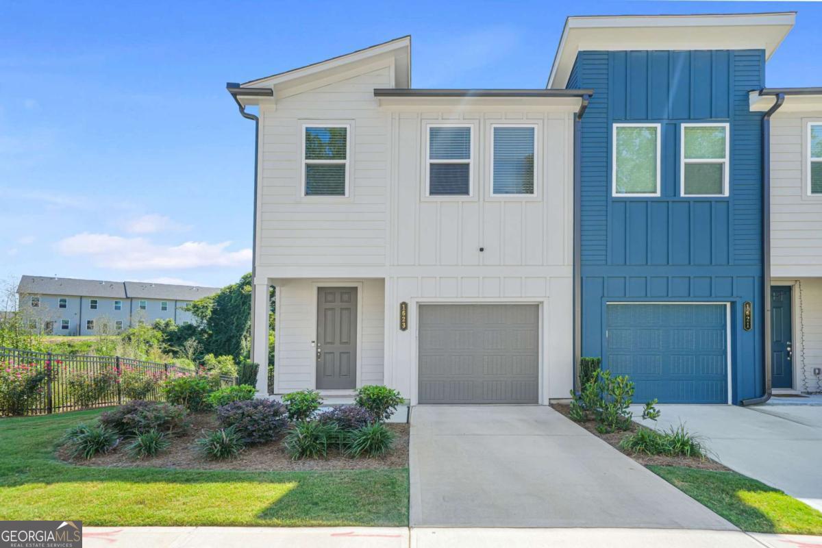 Like-new 2024 end-unit townhome in Park Vue, West Midtown, offering 3 bedrooms, 2.5 baths, modern design, and unbeatable location. The open floor plan features a gourmet kitchen with a chef's island, quartz countertops, abundant recessed lighting throughout and stainless steel appliances, flowing seamlessly into the family room-ideal for both entertaining and everyday living. Upstairs, the primary suite provides a spa-like retreat with a walk-in closet, dual vanity, and oversized shower. Two additional bedrooms share a full bath, offering flexibility for guests, office, or home gym. Luxury vinyl flooring in all common living areas with plush carpet in bedrooms. As an end unit, enjoy extra privacy and natural light and a private patio offers an outdoor space to relax or entertain. Parking is a rare Midtown luxury: this home includes a one-car garage with a private driveway for a second vehicle, plus convenient street parking nearby for guests. Community amenities include a pool, cabana, fire pit, grilling stations, and direct access to Westside Park-Atlanta's largest green space. With West Midtown's vibrant dining, nightlife, trails, and growing tech hub just minutes away, this home combines luxury, convenience, and lifestyle in one of Atlanta's most sought-after neighborhoods.
