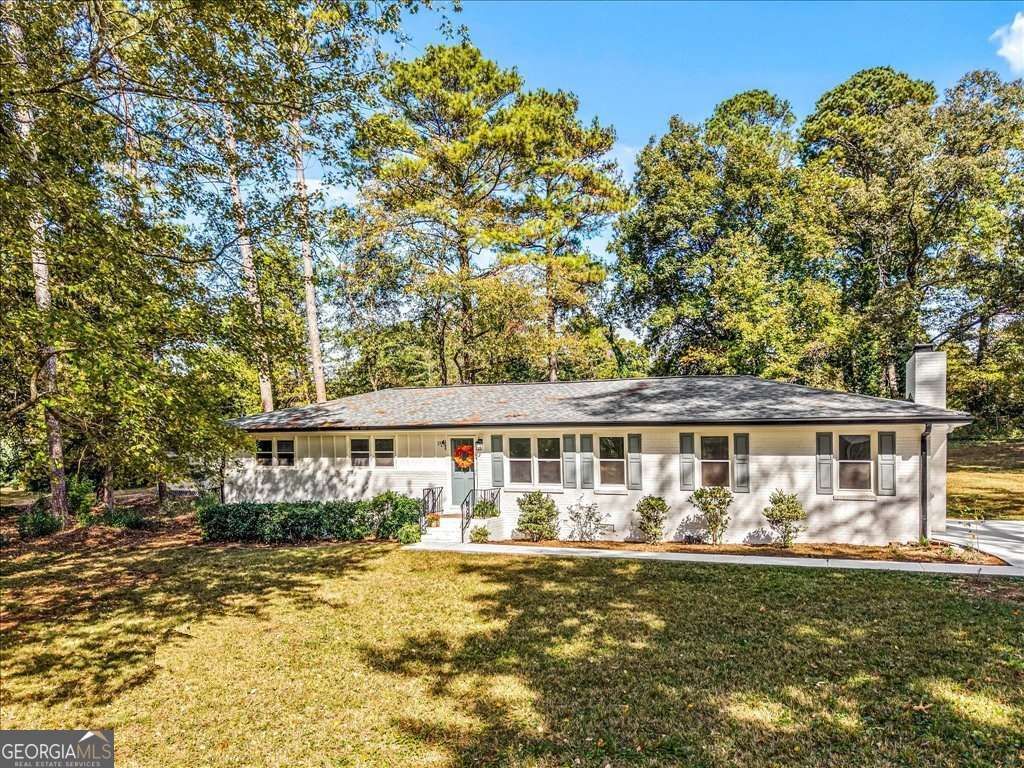 Photo of 1348 Ridgewood Drive SW, Lilburn, GA 30047 (MLS # 10637431)