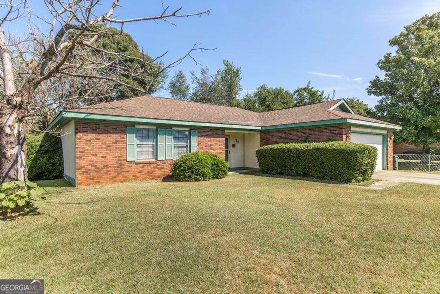 Discover this beautiful 3-bedroom, 2-bathroom home in a highly convenient Warner Robins location. This desirable single-level layout offers two distinct living spaces: a welcoming family room with a wood-burning fireplace and built-in shelving, and a flexible second area currently set up as an entertainment room. The lovely kitchen has been upgraded with granite countertops and provides plentiful storage. The owner's suite includes an updated bath with a modern tile shower/tub combination. Step outside to the large covered patio and fully fenced yard, an ideal spot for pets and entertaining. The seller is offering $5,000 toward closing costs for your finishing touches in lieu of repairs. Call and schedule your showing today!