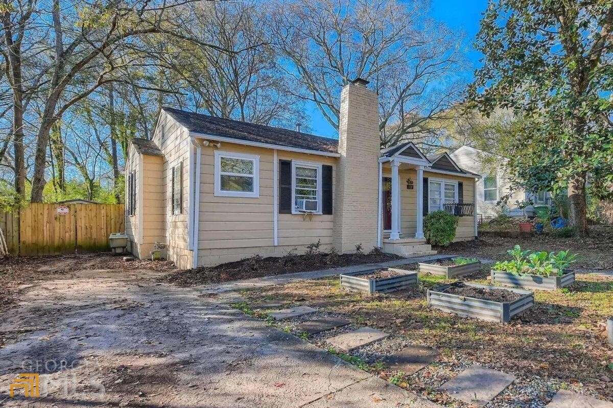 Click the Virtual Tour link to view the 3D Tour. This East Atlanta Village gem is on one of the deepest lots in the neighborhood, with a third of an acre and its own little patch of forest and privacy fence that guarantees seclusion right in the middle of the city. The backyard has a brand-new shed, a green house, and several fruit trees. The laundry/mud room is conveniently located off the back porch. Less than a mile to EAV and located on a very friendly street with great neighbors, this prime location is highly sought after.The house offers two spacious bedrooms with the expanded master bedroom offering an updated ensuite bathroom. Choose how to use the flex room: as a dining room, office or additional master located on the other side of the house. Sold "as is". Bring ALL cash offers to the table! Owner needs a quick close because of relocation.