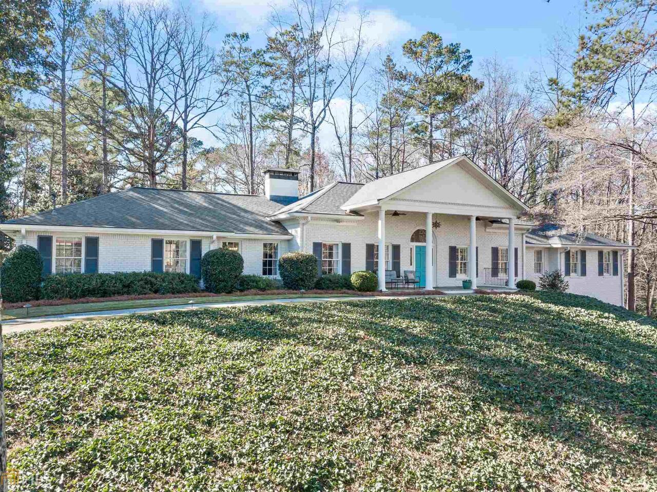 Rare sprawling ranch on basement in Chastain & Jackson Elementary. Beautifully painted brick with rocking chair front porch.  Inviting entrance foyer with hardwoods throughout leads to spacious formal Living Room and separate well appointed Dining Room. Open floorplan with timeless kitchen w/custom cabinets, upgraded lighting & entertainers island opens to oversized Great Room with abundant windows overlooking beautiful backyard.  Main level walk out to level lot with room for a pool next to a cul-de-sac. Enjoy the designer bar area and additional seating area - perfect for all your needs.  Master on main with 3 additional generous sized bedrooms & updated bathrooms.  Full unfinished basement awaits your touches to call home.  Gracious space throughout that has been meticulously maintained.  Prime location and one of the best lots just footsteps from Chastain Park!!  Enjoy the aquatic center, new playground, widened jogging path, swimming, horse park, amphitheater, tennis courts, NYO ball fields, golf course, gym, & neighborhood events!