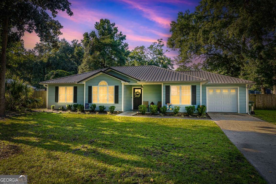 Welcome to your dream home! This charming 3-bedroom, 2-bathroom ranch is a perfect blend of modern updates and timeless farmhouse appeal. Nestled in a centrally located neighborhood, this 1598 sq ft residence offers the ideal combination of comfort and convenience, with no HOA and no flood zone. As you step inside, you'll be greeted by farmhouse finishings and updated stainless steel appliances. The spacious bedrooms provide plenty of room. Outside, the property boasts a generous-sized front yard and backyard, perfect for outdoor activities and relaxation. Additional features include a durable metal roof, low-maintenance vinyl siding, and a convenient one-car garage. Located within minutes of Brunswick, shopping, restaurants, and more, this home is an excellent investment or starter home opportunity. Don't miss out on this gem!
