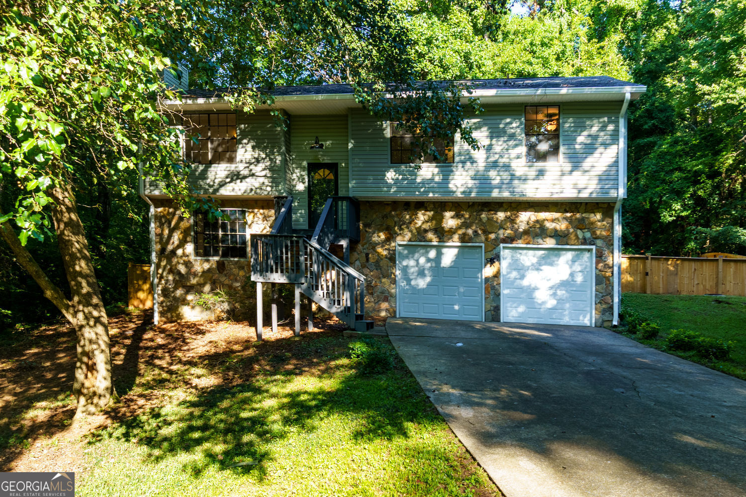 Welcome to your dream home! This fully renovated gem combines timeless craftsmanship with modern style, perfectly situated in one of Acworth's most sought-after neighborhoods. Located just minutes from Kennesaw State University, top-rated schools, shopping, dining, and major commuter routes, this home offers both convenience and charm. Step inside to discover a thoughtfully executed full flip, showcasing designer finishes throughout. The spacious floor plan boasts custom touches in every corner-including a beautifully built custom closet addition offering both function and luxury. Entertain with ease on the extended back deck, complete with a newly added staircase that flows seamlessly into the landscaped backyard-ideal for hosting, relaxing, or simply enjoying the outdoors. Meticulous attention to detail and quality craftsmanship make this home stand out. From the upgraded fixtures to the rich flooring and stylish finishes, every inch has been curated to impress. Whether you're looking for a smart investment or a forever home, 1172 Ridgeside Drive checks every box.