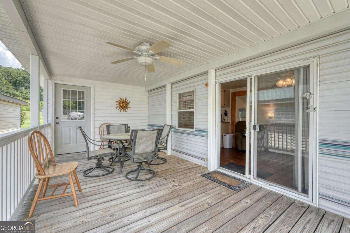 Motivated Seller! Nice and clean 2 bedroom 1 bath Hyland Park RV with a 2008 17 x 10 Bedroom and bath addition for a vacation home or affordable full-time living. Enjoy being a part of this riverfront golf cart community with a community pool, pond, pavilion, and river access for tubing or trout fishing. HOA Fee includes water, sewer, trash, trailer and boat storage, and maintenance of common areas such as the pool and playground. Central electric heat unit with a small gas heater as back-up. Nice covered front porch with table and chairs to relax and enjoy with friends and family. Will be sold with most of the furnishings. 8 x 8 Utility building in back for extra storage. Come to Hiawassee and enjoy the GA Mountain Fairgrounds and its various festivals and concerts. Enjoy other activities such as hiking the Appalachian Trail or boating or fishing on Lake Chatuge.