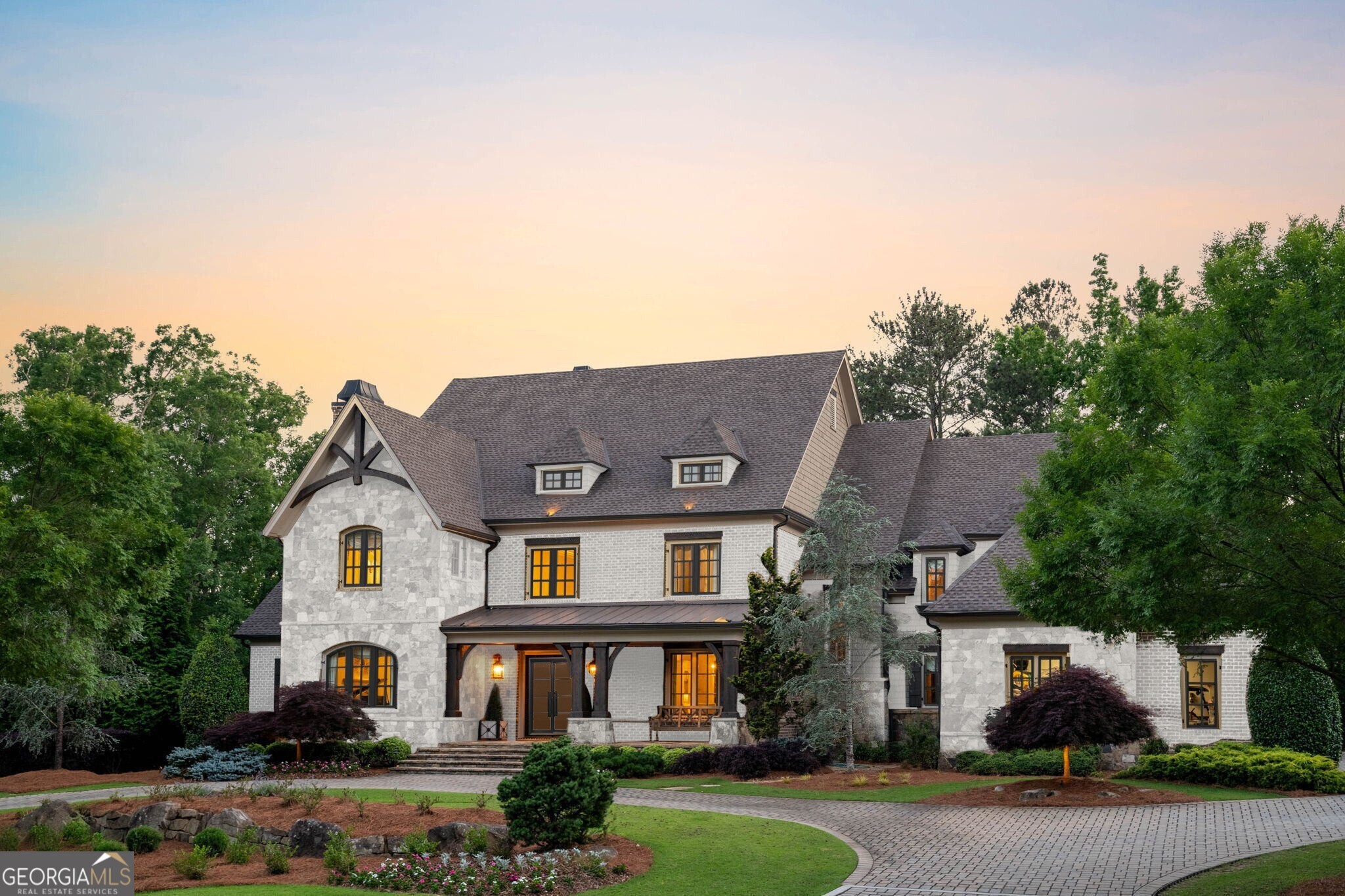 L I V E | U N C O M P R O M I S E D - Coveted River Club location elevated in timeless luxury. 4824 Kettle River Point, the neighborhood's most desirable estate offering an unrivaled blend of comfort, luxury, security, and technological sophistication, making it a haven for the most discerning homeowner. Enjoy coveted luxuries such as dual primary bedrooms, dual mature landscaped homesites, elevator shaft, irrigation well, and pool ready homesite overlooking the 4th fairway! Enter through the captivating clear story foyer, setting the stage for the indulgence which awaits. Every detail has been meticulously crafted by Robert Wilkins in collaborative design with Shcilling & Company to elevate your living experience, from the custom Italian Alps sourced marble kitchen to the warm embrace of walnut flooring throughout. Entertainment is effortless with integrated surround sound and Control 4 smart home technology, seamlessly harmonizing your environment to your preferences. Motorized window treatments, custom lighting, and four gas log fireplaces add an extra layer of comfort and convenience. Indulge in outdoor living at its finest with dual rear loggias featuring automated phantom screens, a grilling lounge, and a plunge pool, all overlooking breathtaking golf course views and mature wooded landscapes. Inside, discover the ultimate in relaxation and entertainment with amenities such as a billiards lounge, home fitness center, and dedicated men's and women's lounges. Dual wine cellars, a custom bar, and marble countertops ensure that every gathering is unforgettable. This estate also boasts practical luxuries, including dual laundry rooms, dual home offices, a guest wing, and an elevator shaft for effortless access to all levels. Retreat to the tranquility of your steam room or unwind in one of the dual loggias after a long day. Unparalleled craftsmanship, timeless design elements like reclaimed 19th-century mantels and limestone fireplaces, paired with modern conveniences of integrated Wolf and Sub-Zero appliances, Scotsman ice machine, and herringbone slate flooring, this home is a true masterpiece. Preserving nature is paramount, evident in the meticulously landscaped private level homesite and permeable pavers that harmonize with the surroundings. Experience the epitome of luxury living with unmatched security, privacy, and tranquility in this exceptional estate. The River Club private membership affords endless entertainment whether it's tennis or pickeball matches, swimming or splashing at the Jr. Olympic pool and splash pad, zipping down the 150ft triple loop waterslide or taking a swing at the Greg Norman designed private championship golf course playable to all skill levels. Schedule your private tour today and make your dream home a reality. Primary image has been virtually painted.