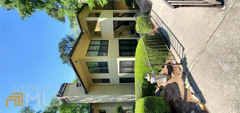 Investment Opportunity! Make your own repairs and have instant equity! Walk to see the Braves with this 2 bedroom, 2 bath condominium! The entry foyer welcomes you to a spacious family room with vaulted ceilings and a dining area. The kitchen features plenty of counter space and cabinet space along with view of family room. The primary bedroom features separate his and her closets with a private bathroom complete with a double vanity. Covered back deck overlooking the community. This home is minutes from Cobb Parkway and Truist Park.