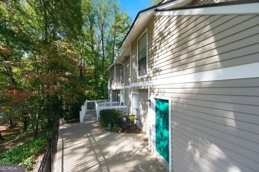 Welcome to this charming 2 Bedroom, 2 Bath end-unit condo in the highly sought-after Wynnes Ridge Swim/Tennis Community! This bright and airy home offers an open floor plan filled with natural light. The inviting living room features a cozy fireplace, built-in shelving, and sliding glass doors that lead to your own private screened patio-perfect for relaxing or entertaining.    The spacious laundry room includes a washer and dryer for added convenience. Enjoy the peace of mind that comes with living in an FHA-approved community with no rental restrictions-a rare find in East Cobb!    Ideally located just minutes from I-75, I-285, The Battery Atlanta, Cochran Shoals Trail, Terrell Mill Park, and the Chattahoochee River, you'll have easy access to shopping, dining, and outdoor recreation.    Wynnes Ridge offers fantastic community amenities, including tennis courts and a refreshing saltwater pool, all nestled in a serene, well-maintained neighborhood.    This one checks all the boxes for comfort, convenience, and value-don't miss your chance to call Wynnes Ridge home!