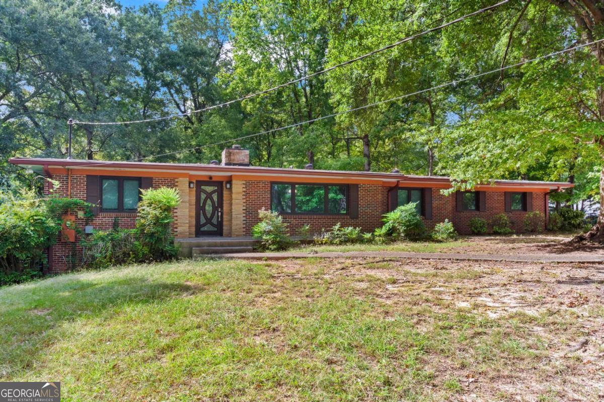 Welcome to this beautifully updated home in the heart of Vinings Jubilee, just minutes from Smyrna and I-75. Completely rebuilt and renovated in 2012, this property blends modern updates with timeless comfort. Primary suite on main, with two additional bedrooms and two full baths. The large kitchen features soft-close cabinets, generous counter space, and is truly a chef's dream kitchen. Throughout the home, you'll find thoughtful updates that make it move-in ready. Downstairs, a finished basement apartment with a separate entrance provides incredible flexibility, complete with one bedroom, one bathroom, full kitchen, and its own living space. It's ideal for guests, in-laws, or rental potential. Outdoor living is just as impressive with a screened-in patio, storage shed, and an additional outbuilding that can serve as a workshop or extra storage. Major systems have been updated for peace of mind, including the roof, which was replaced in 2020, a newer HVAC, and a tankless water heater. This home combines location, convenience, and functionality in one of the most desirable areas near Vinings and Smyrna.