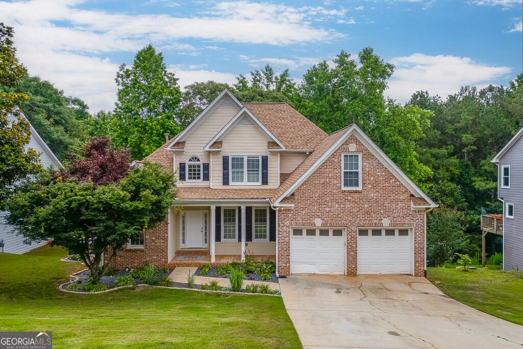 Welcome to this stunning, fully upgraded brick-front home in the desirable Headwaters community of Flowery Branch. This spacious two-story residence with a full basement offers an ideal blend of comfort and elegance, featuring extensive trim work, upgraded flooring, and a thoughtfully remodeled interior throughout. The main level boasts a luxurious owner's suite with tray ceilings, double vanities, and a large walk-in closet. The kitchen has been completely updated with quartz countertops, stainless steel appliances, custom cabinetry, and a modern layout perfect for everyday living and entertaining. Upstairs, you'll find additional bedrooms and living space, while the basement offers endless potential for expansion or storage. The fenced backyard is perfect for outdoor gatherings and the home includes a two-car garage. Located in a quiet, friendly neighborhood with no detail overlooked, this home is move-in ready and just minutes from shopping, dining, and I-985 access.