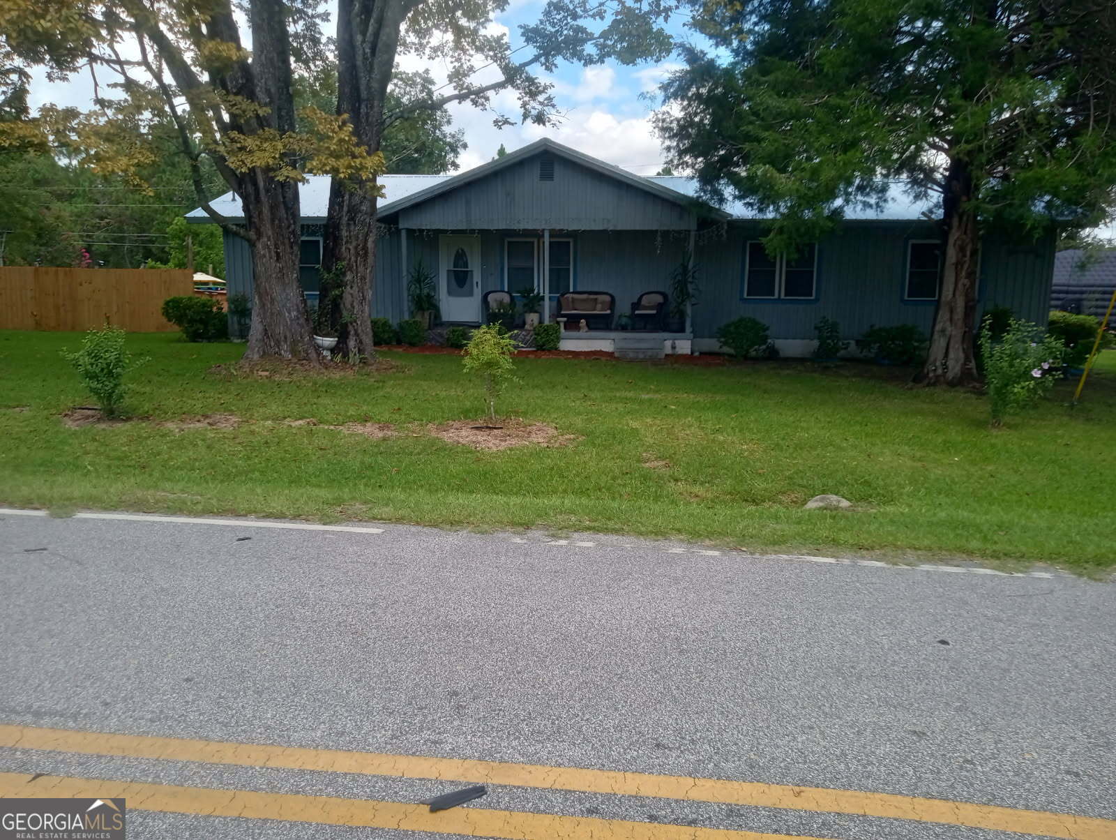 Take a look at this beautiful home on the edge of town in a low traffic area! House features a metal roof, spacious open yard, road access from front or rear of property, and so much more. You will be only a few minutes drive from shopping, medical offices, restaurants and much more! This one wont last long.