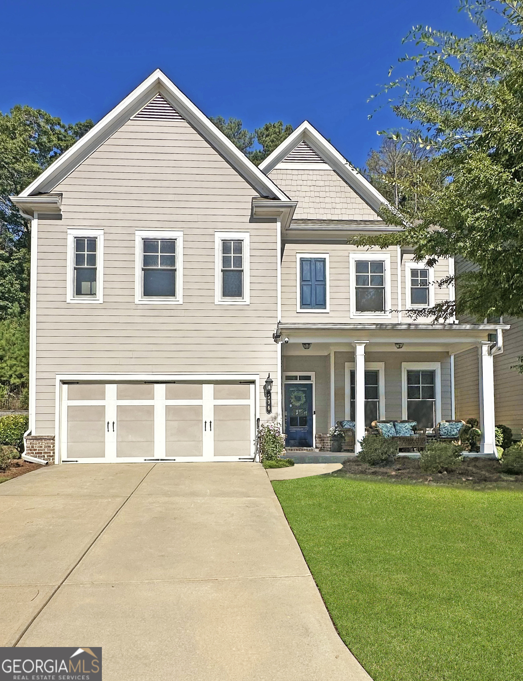 Location, Lifestyle, & Living in the Heart of Suwanee! Beautiful 5BR/4BA home in sought-after Suwanee Green with walkability to Suwanee Town Center, Martin Farm Park, & Greenway. Located in award-winning North Gwinnett School District. Welcoming front porch, hardwoods on main, separate dining room, fireside family room, and chef's kitchen with granite island, double ovens & gas cooktop with a seamless flow to the breakfast area. A guest suite with full bath on main. Spacious owner's retreat offers sitting room, spa bath & private access to a screened porch overlooking the serene backyard. Secondary bedrooms feature ensuite or Jack-and-Jill baths. Enjoy year-round outdoor living with a second screened porch and a private, tree-lined backyard. Neighborhood amenities include a pool, playground, and dog park, with lawncare covered by the HOA for maintenance free living. With its unbeatable location-walkable to parks, trails, and vibrant Suwanee Town Center-this home combines elegance, functionality, and lifestyle in one of Georgia's most desirable communities. Welcome Home!