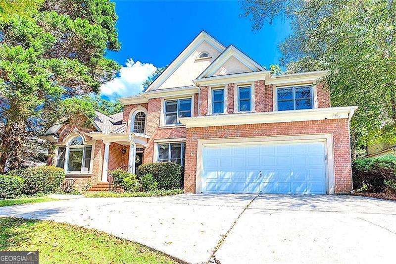 SO MANY UPGRADES! Located in very desirable VININGS ESTATES subdivision, this stunning 5 BEDROOM (one on the main) 4 FULL BATHROOM (one on the main) home features a FULL FINISHED TERRACE, IN-LAW SUITE, and SEPARATE ENTRANCE! This lovely home boasts an incredible NEW KITCHEN REMODEL with striking MARBLE COUNTERTOPS, gorgeous BACKSPLASH, STAINLESS APPLIANCES including DOUBLE OVENS, and a NEW LIGHT FIXTURE. The main level features a large BEDROOM with FRESH PAINT, NEW CARPETING, NEWER FAN, and FULL ENSUITE/HALL BATHROOM. Enjoy meals in the roomy SEPARATE DINING ROOM, with a NEW LIGHT FIXTURE and NEW PAINT. Off the TWO STORY FOYER; NEW CARPETING and FRESH PAINT beautifully compliment the front FORMAL LIVING ROOM/OFFICE. The GREAT ROOM rounds out the main floor with its FLOOR TO CEILING WINDOWS, BUILT-IN BOOKCASES, NEW CARPET, and FRESH PAINT. Walk out to the SCREENED-IN PORCH with NEW INDOOR/OUTDOOR CARPETING. This is the perfect place to enjoy your morning coffee while looking out at the PRIVATE FENCED BACKYARD, designated GARDEN, and NEW DECK. Venture upstairs and notice the NEW CARPETING and FRESH PAINT. The OVERSIZED PRIMARY BEDROOM allows for an office desk or sitting area in addition to a king sized bed. The gorgeous REMODELED PRIMARY BATHROOM with MARBLE FLOORS and BATH SURROUND, luxurious STEAM SHOWER, SEPARATE WATER CLOSET, DUAL VANITIES, and SEPARATE SOAKING TUB speaks for itself. Large SEPARATE DUAL CLOSETS, NEW LIGHT FIXTURE, and FRESH PAINT set the bathroom off. TWO LARGE SECONDARY bedrooms upstairs BOTH boast NEW PAINT and NEW CARPET. One has a NEW FANDELIER with a large closet and one has a WALK-IN CLOSET. They share a JACK AND JILL BATHROOM. The LAUNDRY LOCATED ON UPPER FLOOR is convenient for all. Time to explore the SPACOUS FULL FINISHED DAYLIGHT IN-LAW SUITE located on the terrace level complete with a SEPARATE ENTRANCE and KITCHENETTE! This space spotlights a FAMILY/OR SECOND PRIMARY ROOM, decorative FIREPLACE, BUILT-IN BOOKCASES, a large RECREATION ROOM, and a SITTING/craft AREA. There is also a large SECONDARY BEDROOM with NEW PAINT and NEW CARPET. There is also plenty of UNFINISHED STORAGE downstairs. Want to earn passive income? Rent the terrace out! This home is zoned for an AWARD WINING IB PROGRAM at CAMPBELL HIGH SCHOOL and Whitefield Academy is located right outside the subdivision. Vinings Estates is an active swim/tennis community featuring 3 Pools, 2 clubhouses, 6 tennis courts and 6 pickleball courts (different ALTA teams for both tennis and pickleball), a basketball court, koi pond, playground, fitness center, hiking trails, swim team, and a very active social committee. Vinings Estates is conveniently located to I-285 with easy access to the airport, Buckhead, and Midtown. There are restaurants, shopping, Heritage Park,The Battery/Truist Park, Smyrna Market Village, and the Silver Comet Trail nearby as well.